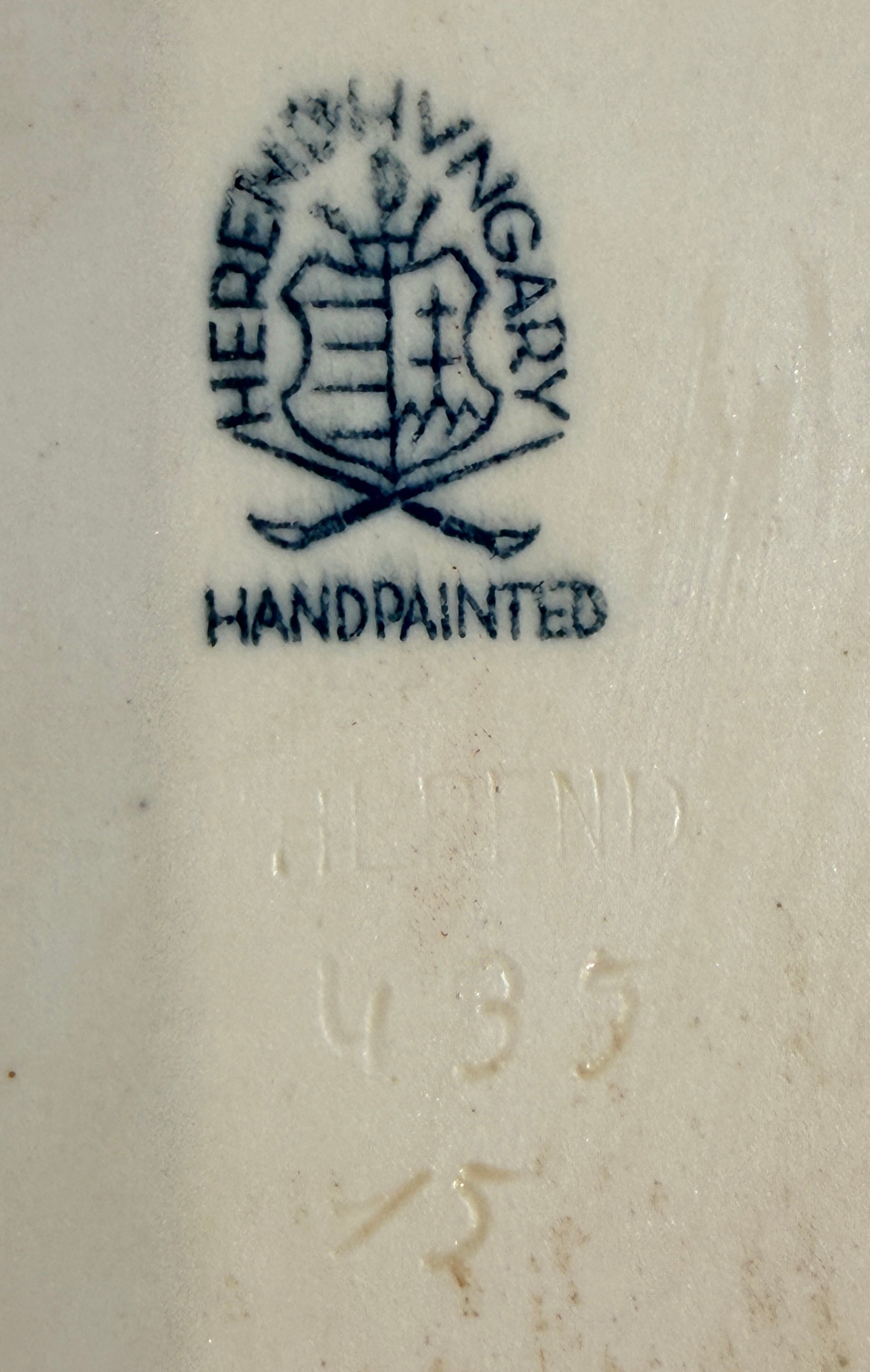 Herend Hungary handpainted logo on a ceramic item with a year code.