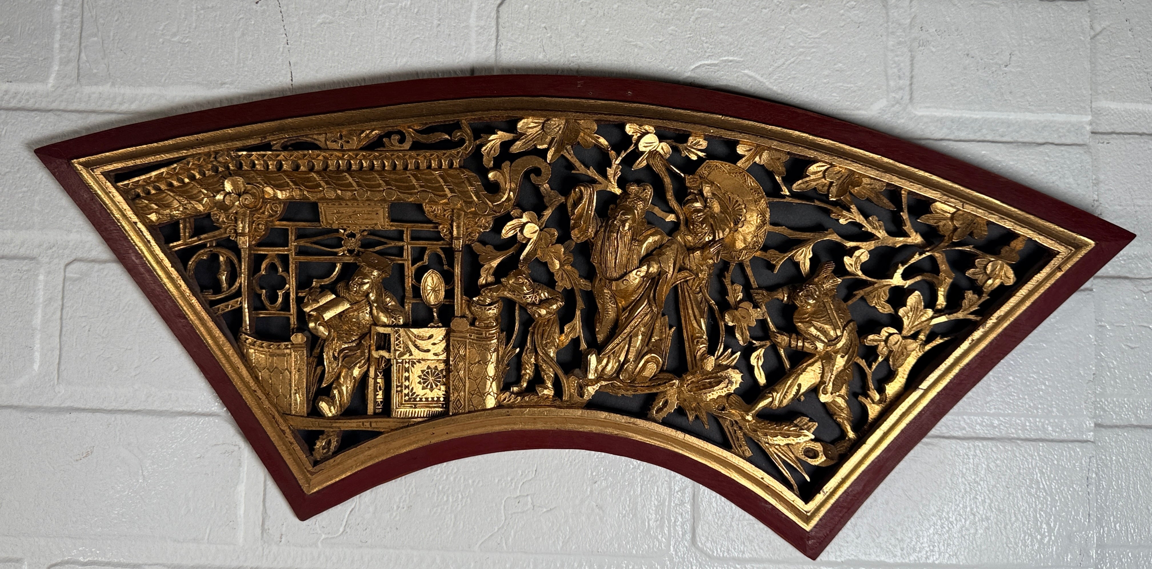 Vintage Chinese carved gilt wood wall panel in fan shape, detailed figural scene, mid-century Chinoiserie décor, openwork carving statement piece.