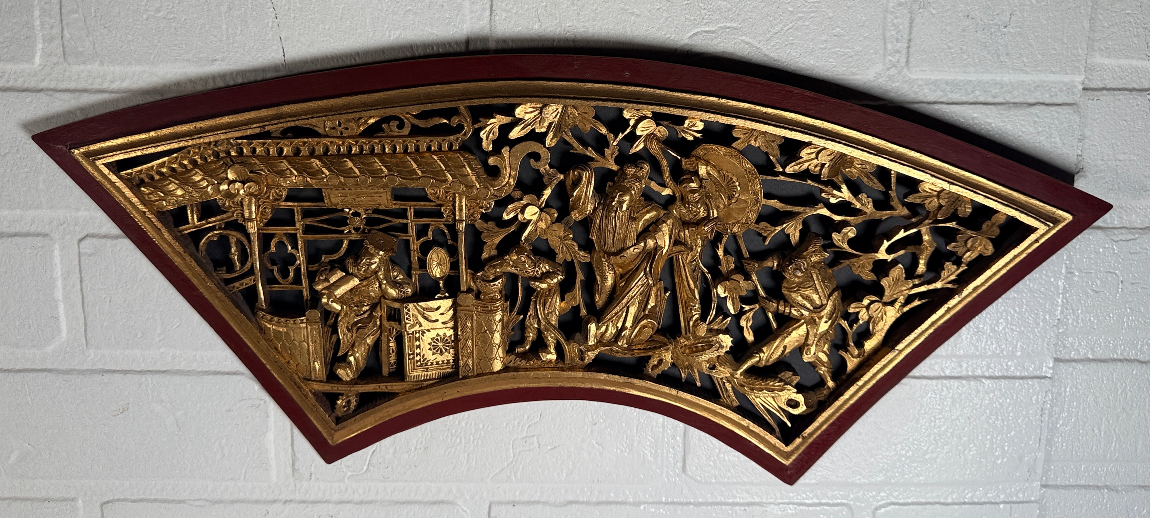 Vintage Chinese carved gilt wood wall panel in fan shape, detailed figural scene, mid-century Chinoiserie décor, openwork carving statement piece.