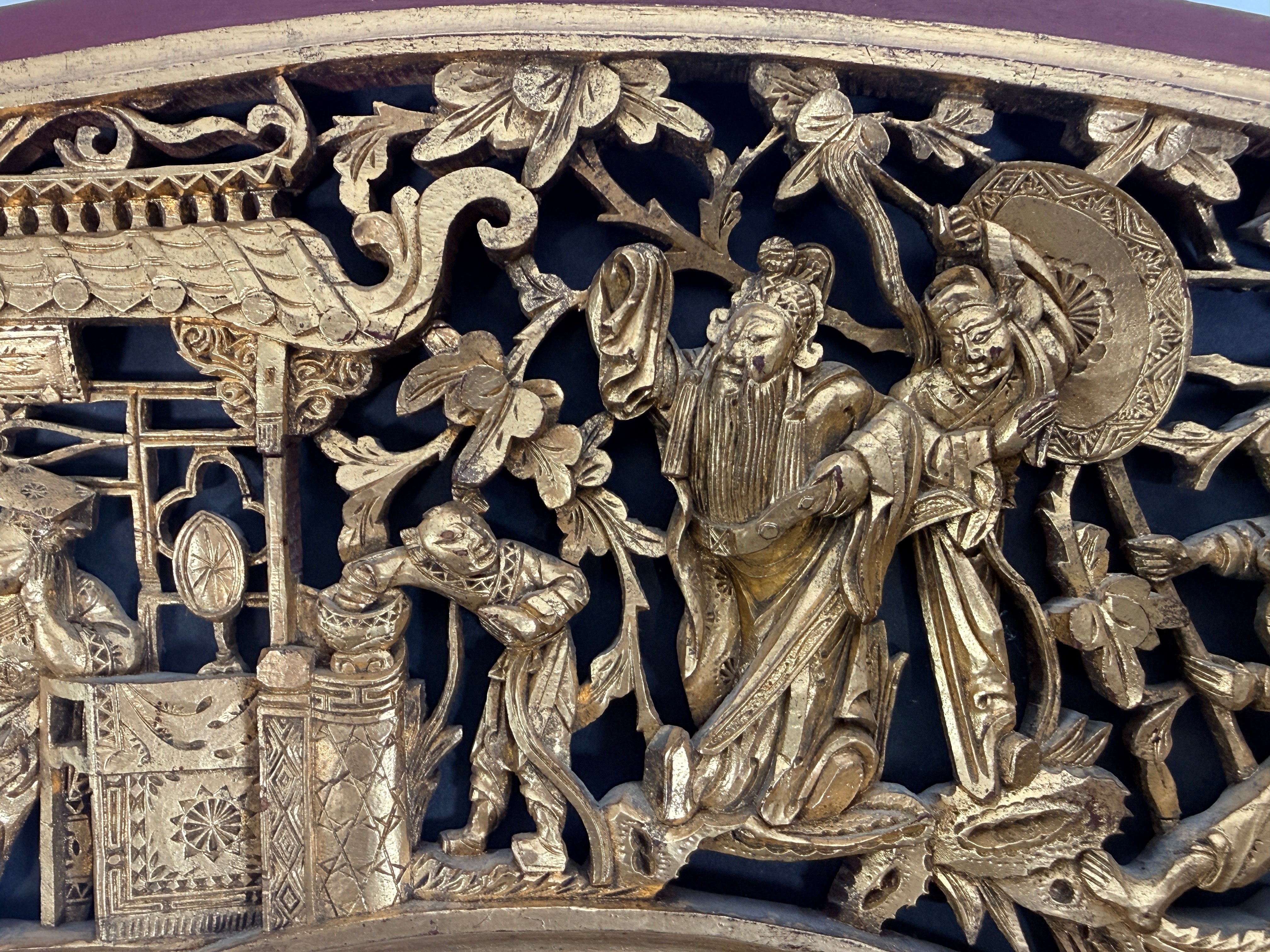 Vintage Chinese carved gilt wood wall panel in fan shape, detailed figural scene, mid-century Chinoiserie décor, openwork carving statement piece.