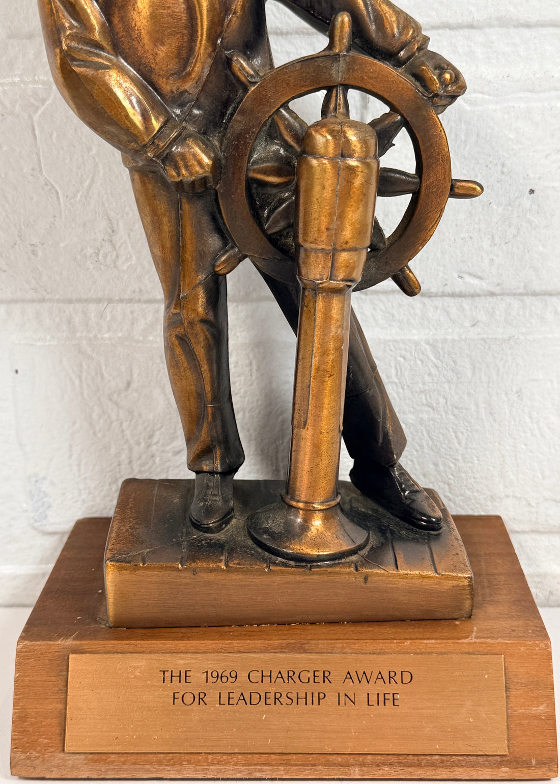 Vintage 1969 sailor helm award statue with bronze finish on wood base. Nautical décor piece with plaque, ideal for maritime collectors or mid-century display