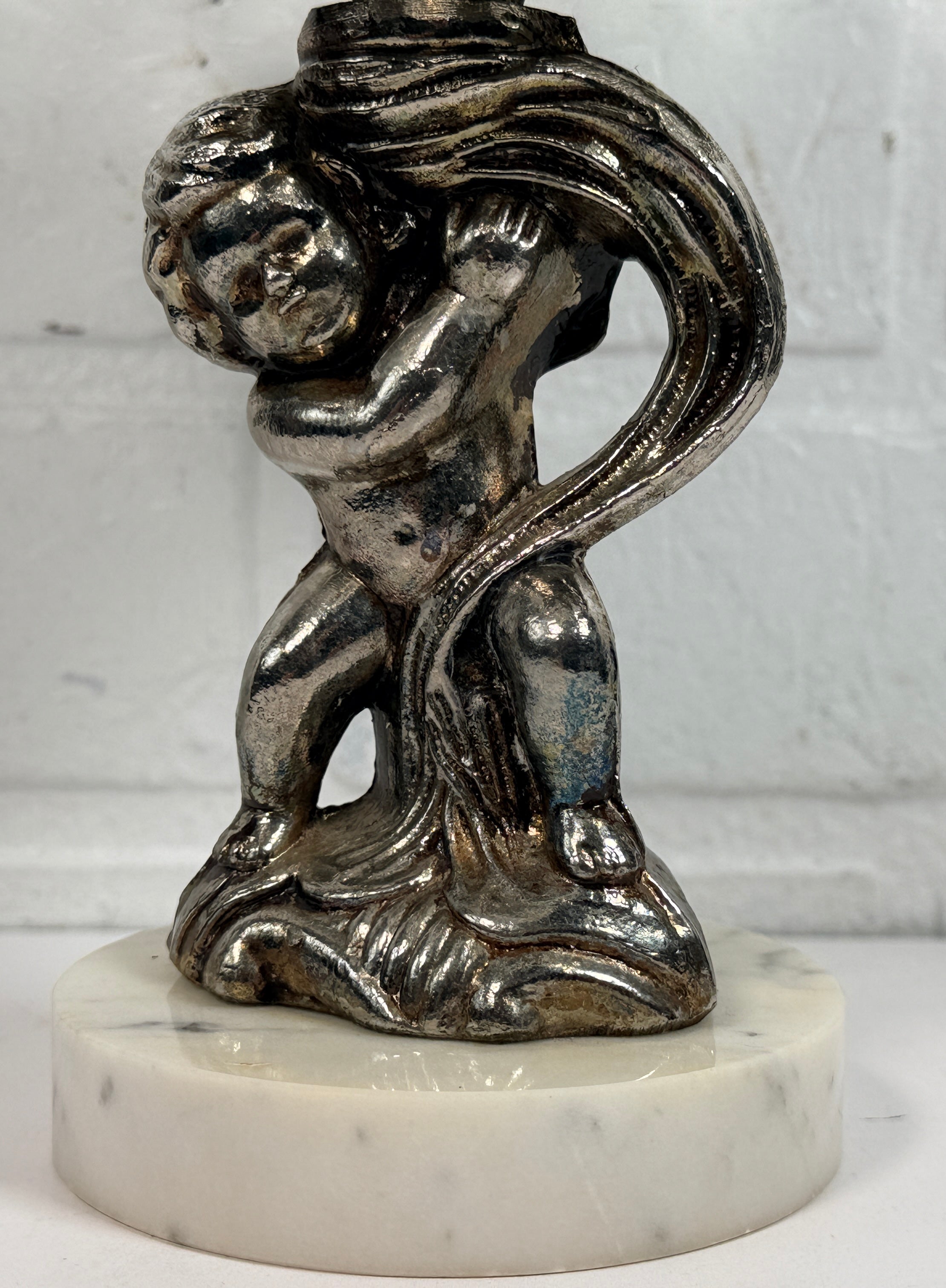 Vintage Hollywood Regency cherub pedestal dish with glass bowl and marble base. Elegant mid-century décor perfect for trinkets, candy, or display.
