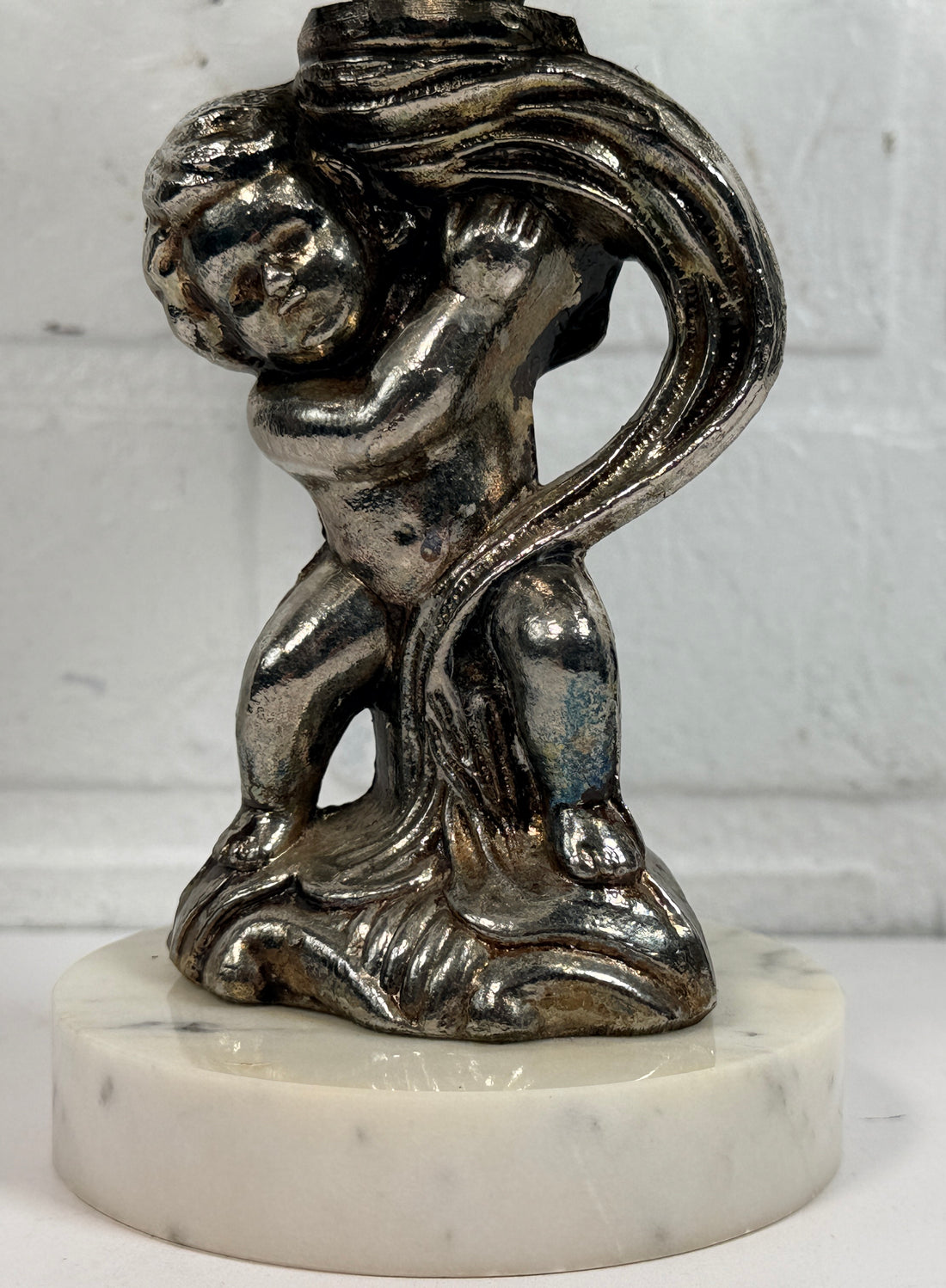 Vintage Hollywood Regency cherub pedestal dish with glass bowl and marble base. Elegant mid-century décor perfect for trinkets, candy, or display.