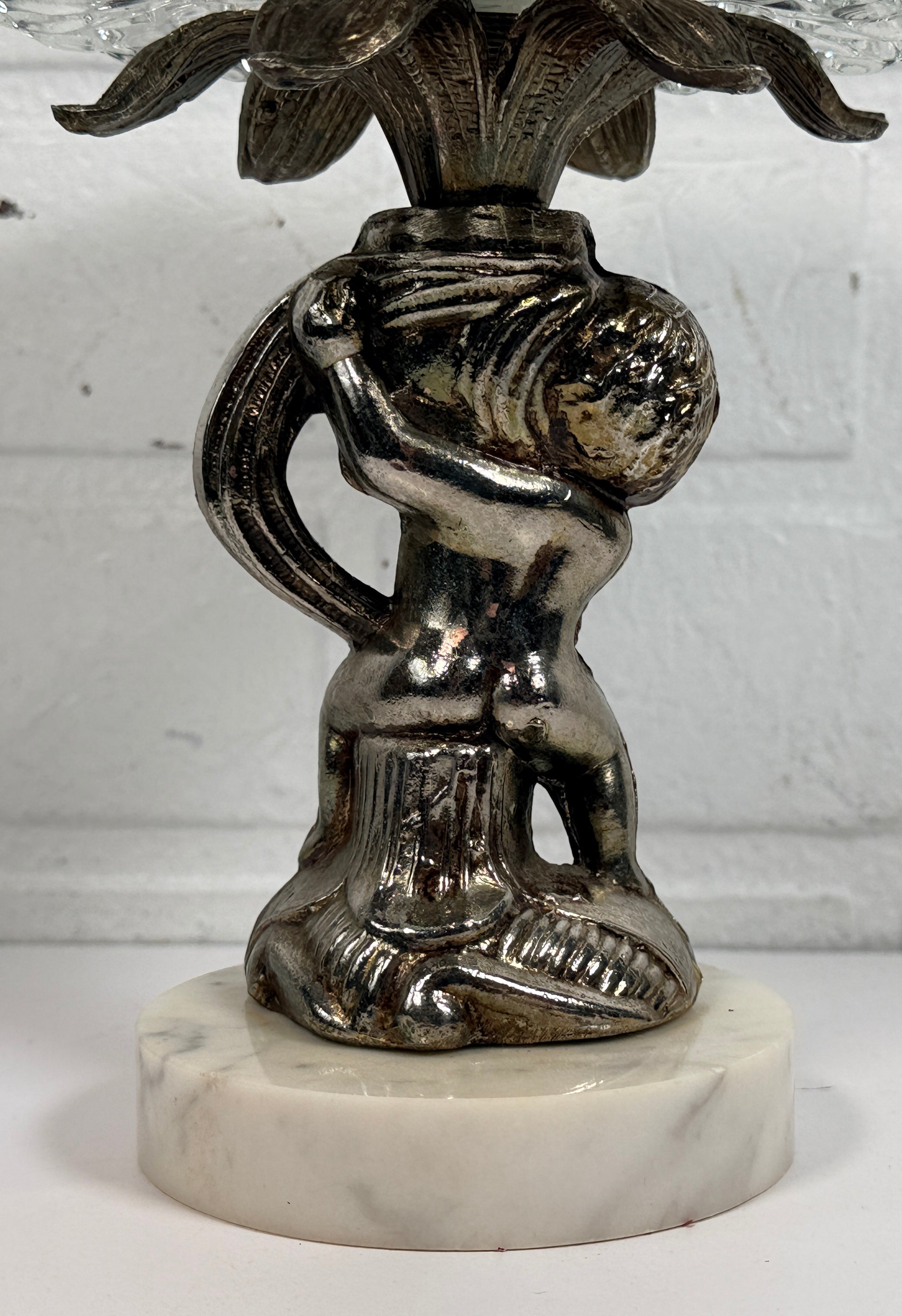 Vintage Hollywood Regency cherub pedestal dish with glass bowl and marble base. Elegant mid-century décor perfect for trinkets, candy, or display.
