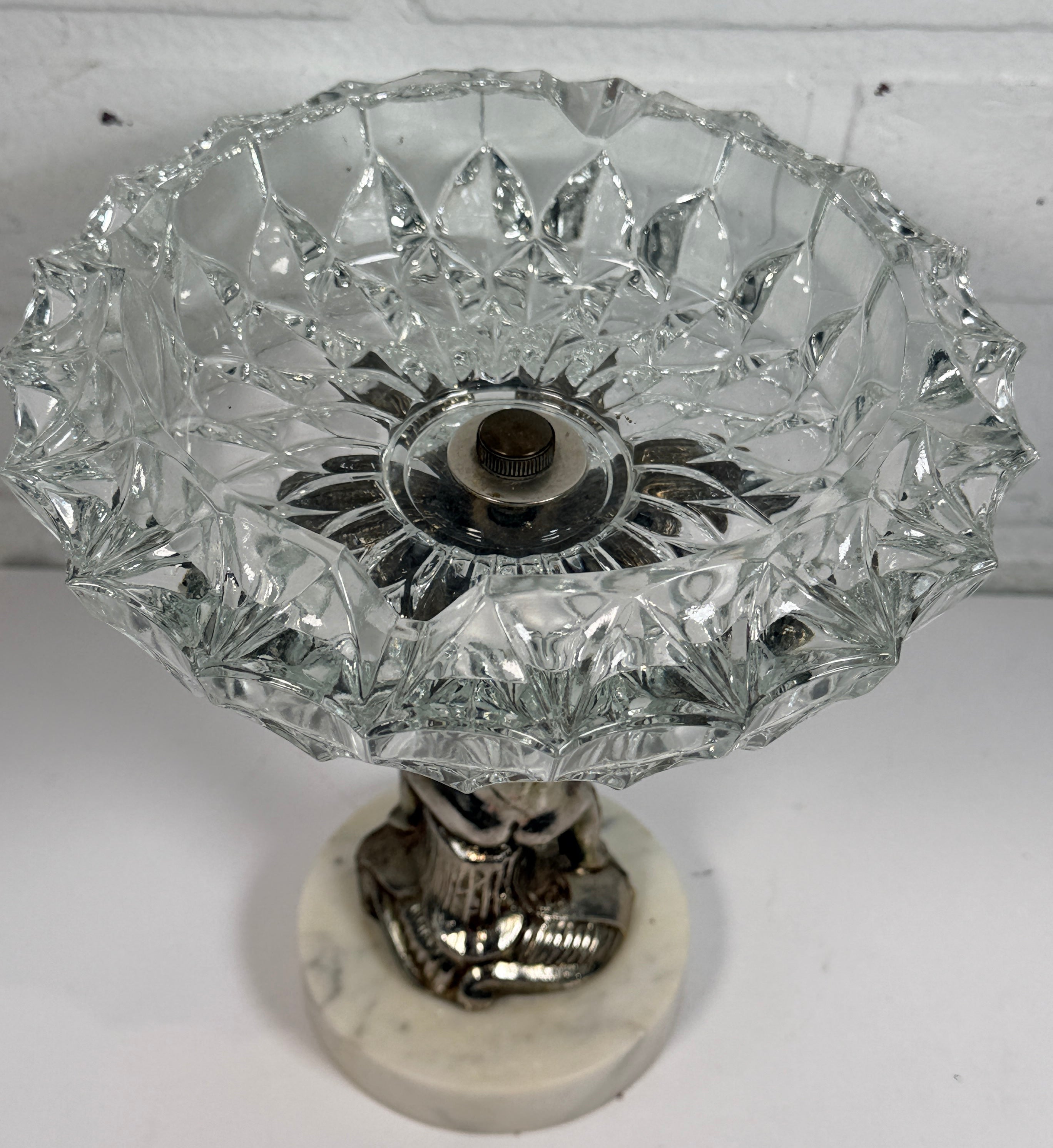 Vintage Hollywood Regency cherub pedestal dish with glass bowl and marble base. Elegant mid-century décor perfect for trinkets, candy, or display.