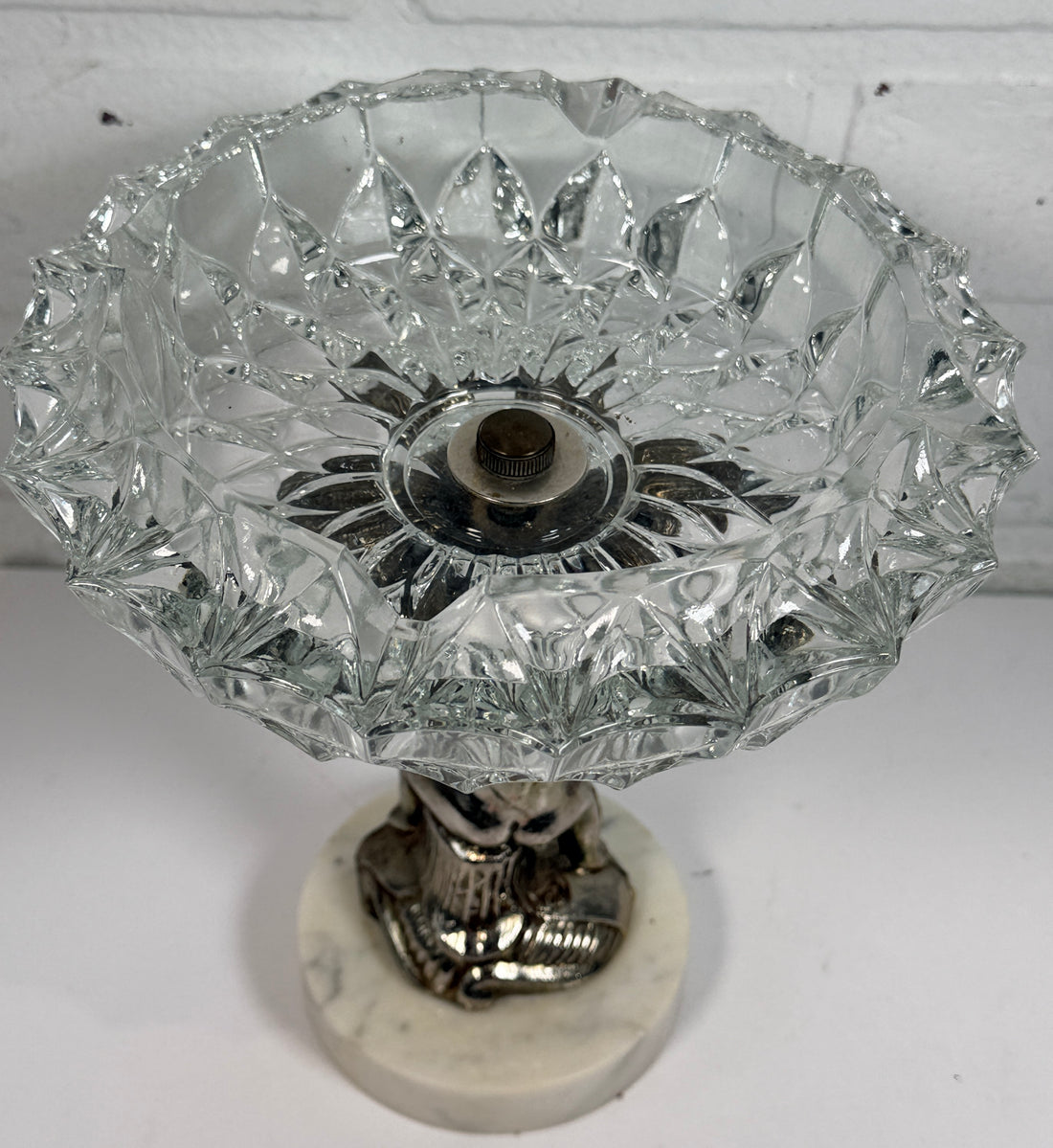 Vintage Hollywood Regency cherub pedestal dish with glass bowl and marble base. Elegant mid-century décor perfect for trinkets, candy, or display.