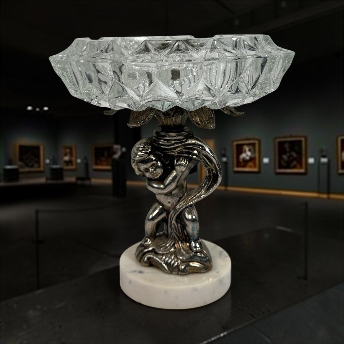 Vintage Hollywood Regency cherub pedestal dish with glass bowl and marble base. Elegant mid-century décor perfect for trinkets, candy, or display.