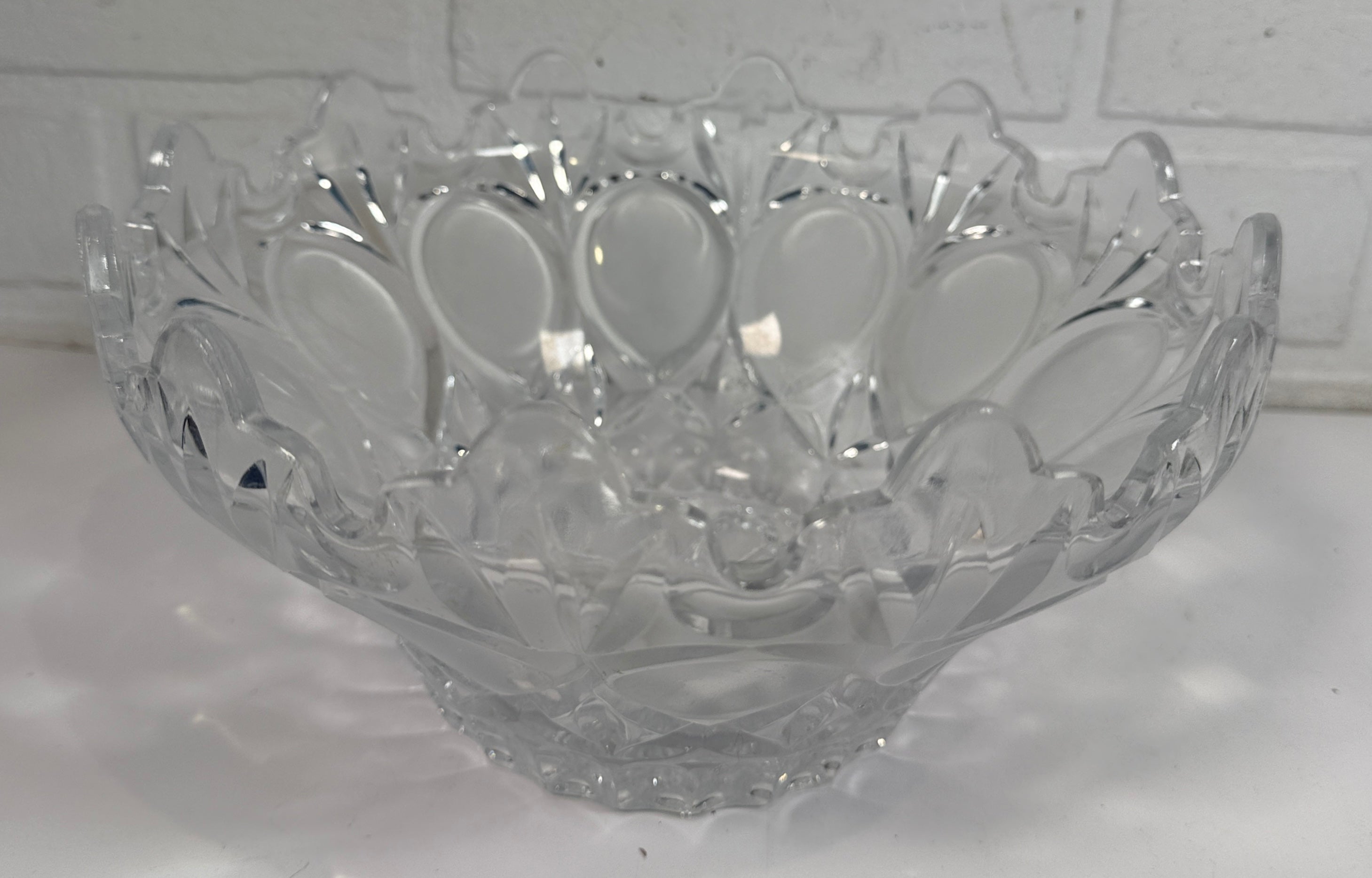Mid-century pressed glass bowl with frosted thumbprint pattern and scalloped rim. Heavy decorative centerpiece perfect for vintage or retro home decor.