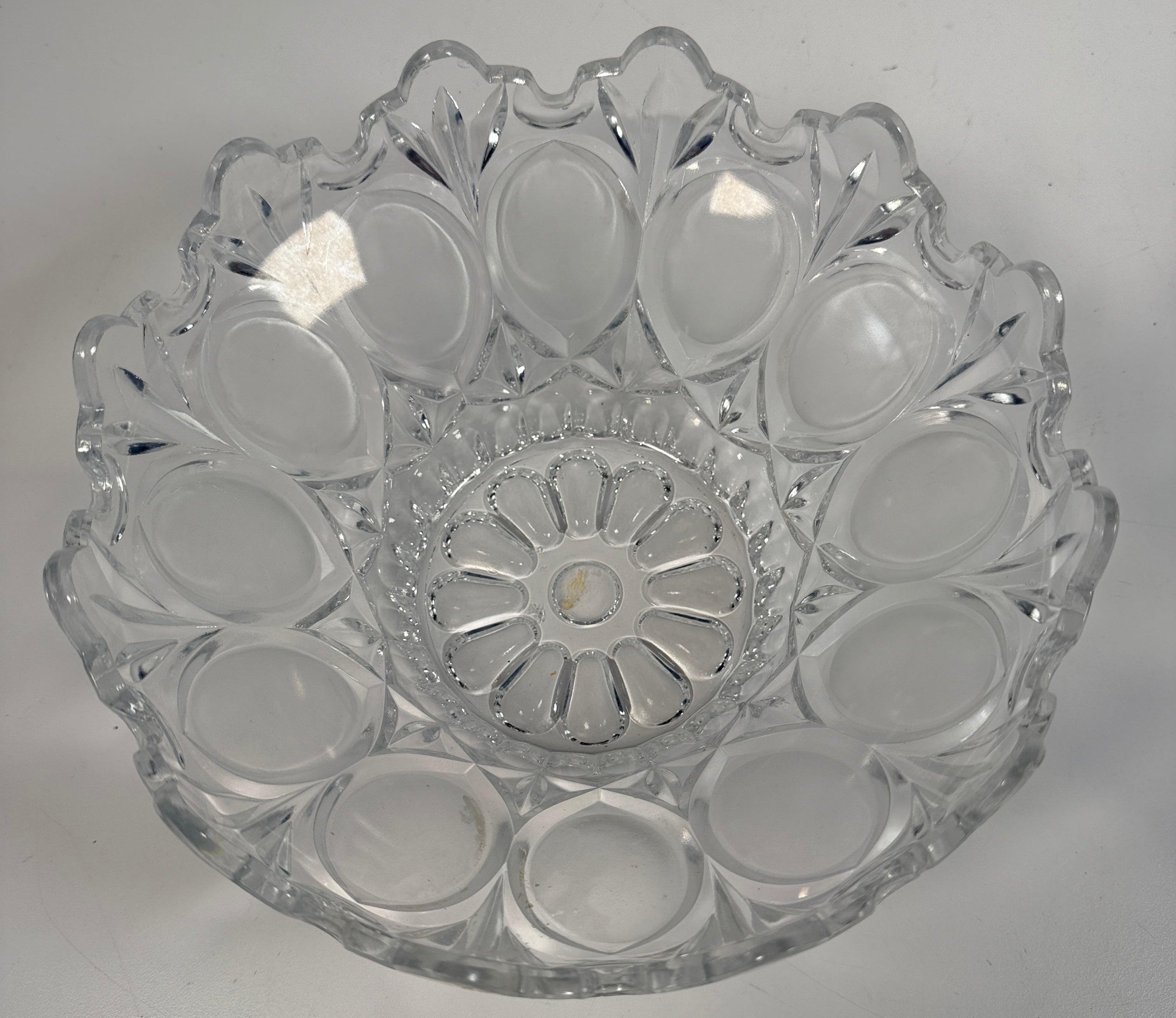Mid-century pressed glass bowl with frosted thumbprint pattern and scalloped rim. Heavy decorative centerpiece perfect for vintage or retro home decor.
