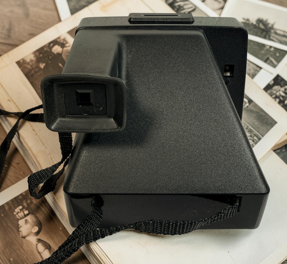 Vintage Polaroid OneStep SX-70 instant camera with rainbow stripe design. Untested and sold as-is. Great collectible retro display camera.