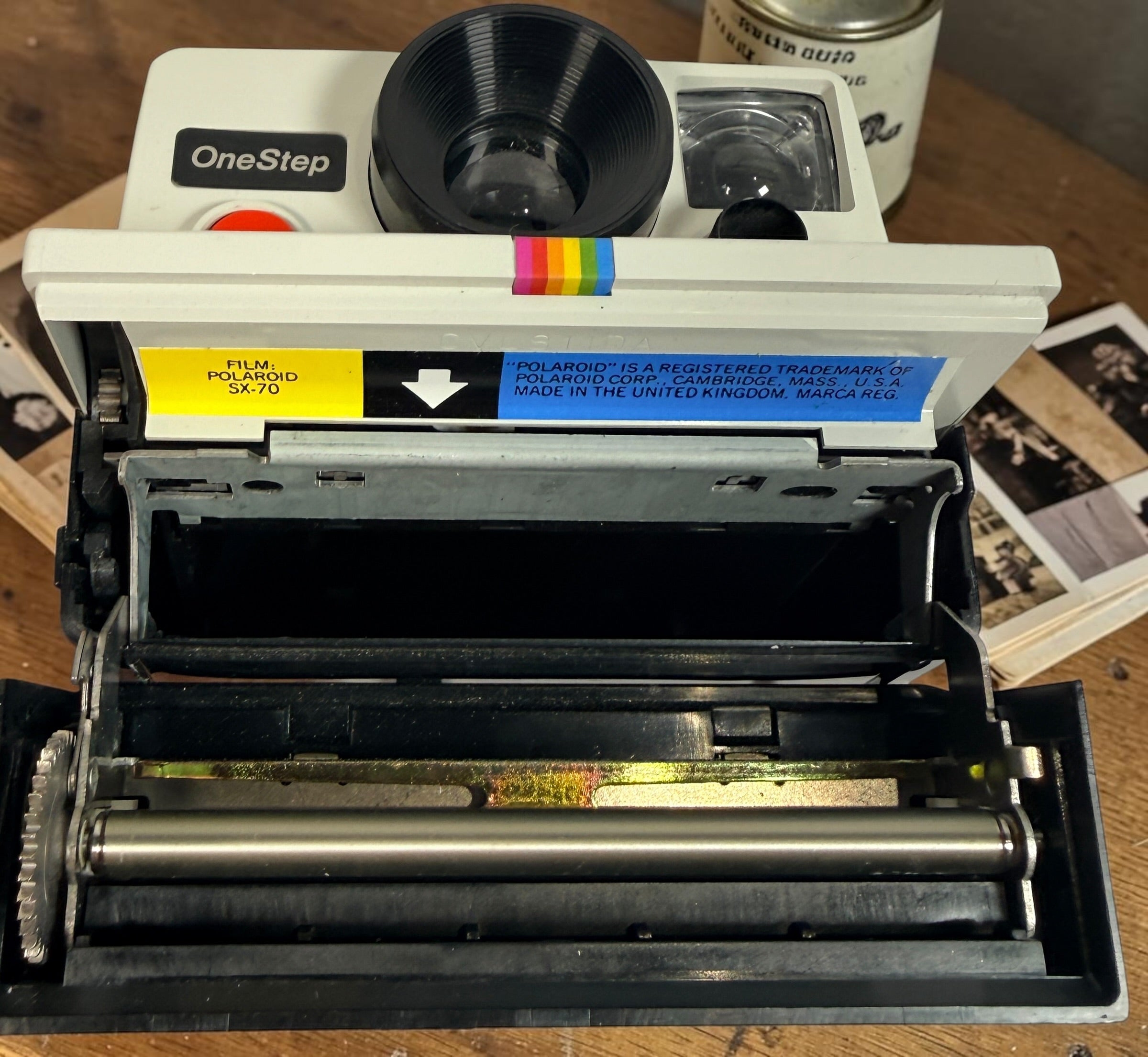 Vintage Polaroid OneStep SX-70 instant camera with rainbow stripe design. Untested and sold as-is. Great collectible retro display camera.