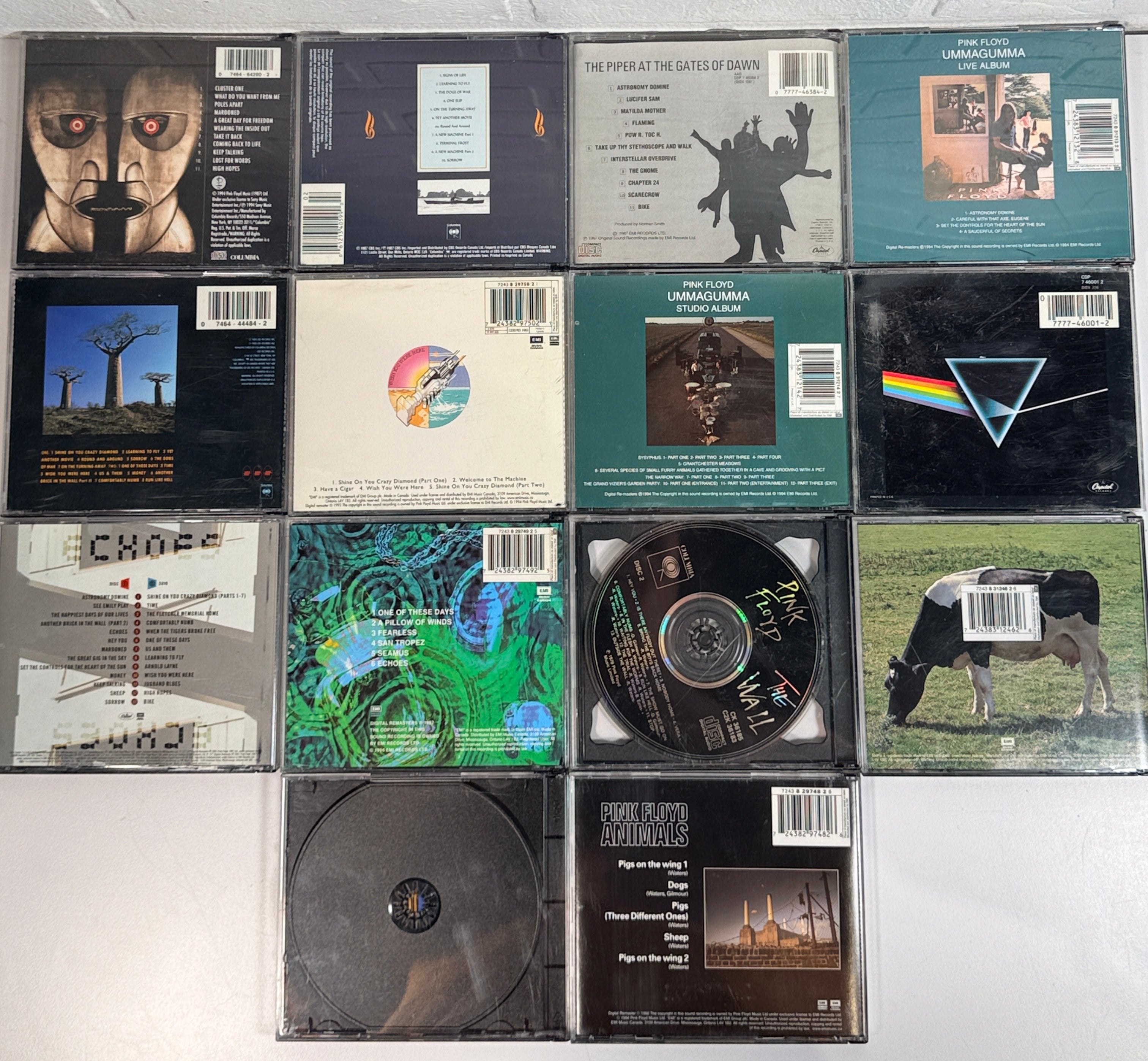 Vintage Pink Floyd CD lot featuring 14 classic albums including Dark Side of the Moon, Animals, Meddle, Wish You Were Here, and Echoes compilation.