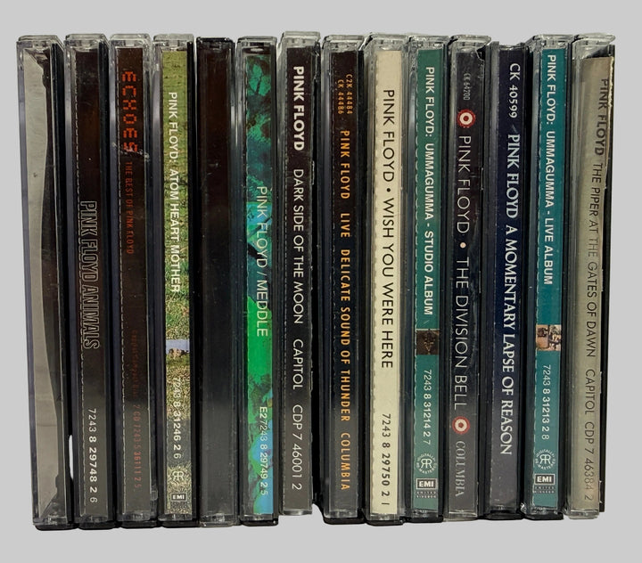 Vintage Pink Floyd CD lot featuring 12 classic albums including Dark Side of the Moon, Animals, Meddle, Wish You Were Here, and Echoes compilation.