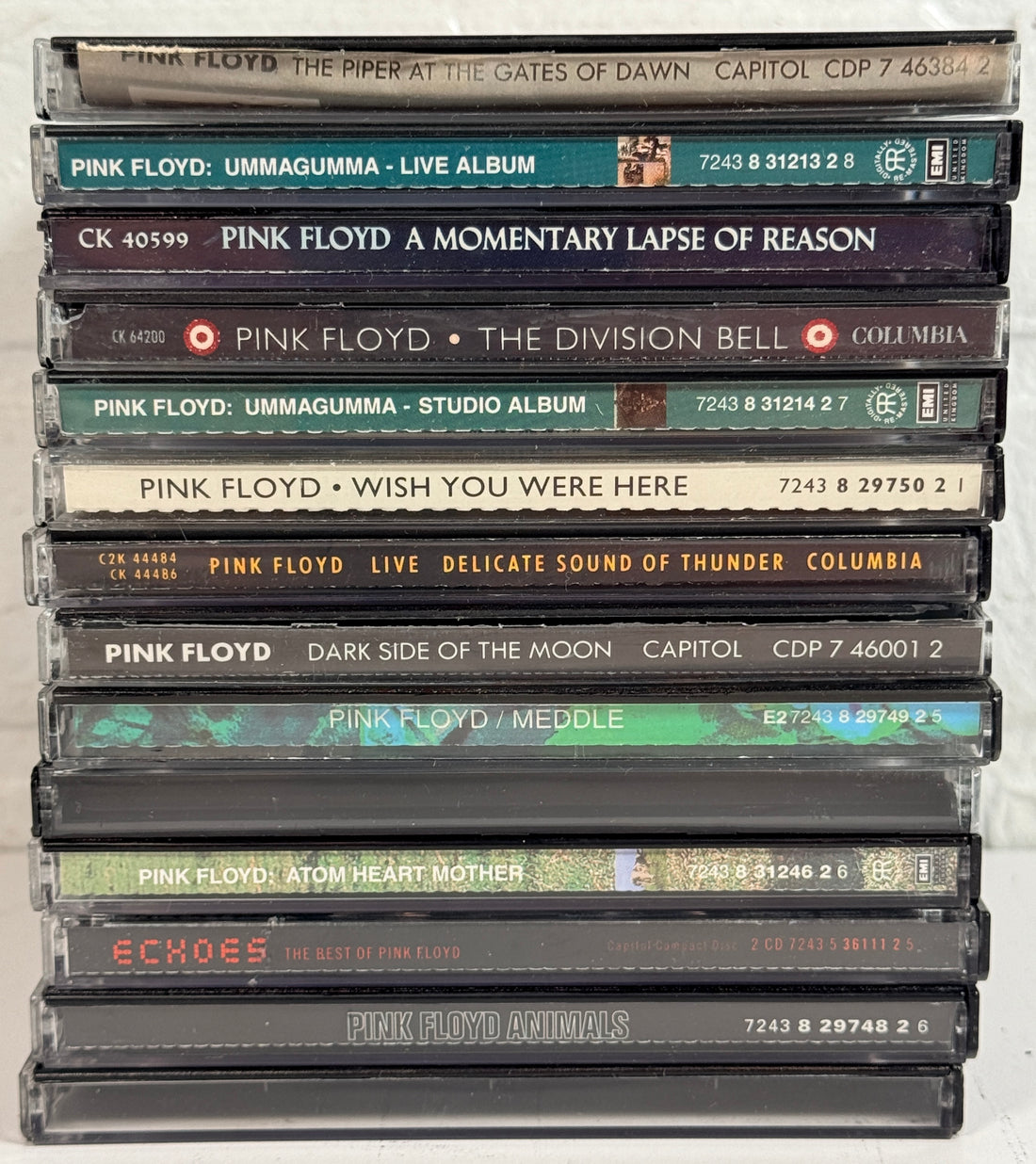 Vintage Pink Floyd CD lot featuring 14 classic albums including Dark Side of the Moon, Animals, Meddle, Wish You Were Here, and Echoes compilation.