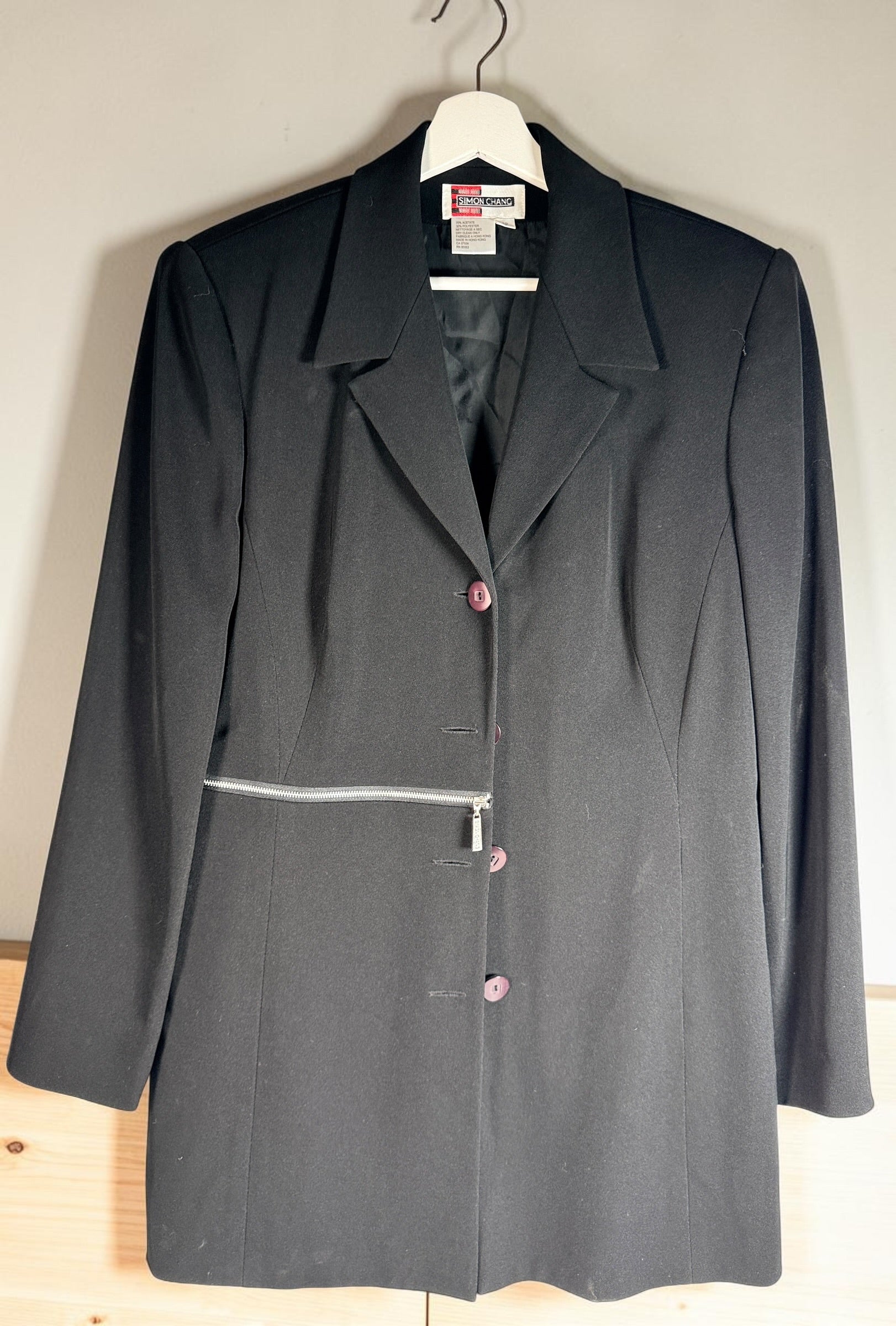 Vintage Simon Chang black blazer with zip waist detail, structured 90s silhouette, size 12. Classic tailored piece with unique design accent.