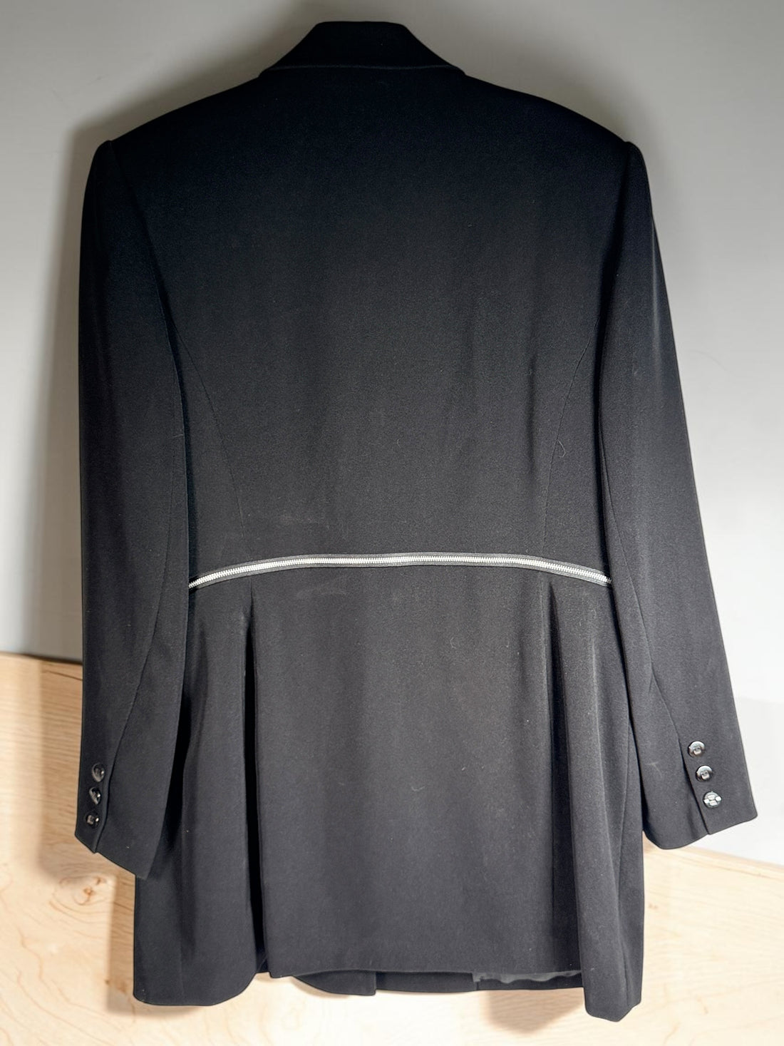 Vintage Simon Chang black blazer with zip waist detail, structured 90s silhouette, size 12. Classic tailored piece with unique design accent.