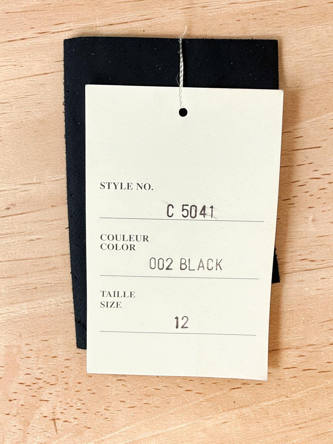 Vintage Simon Chang black blazer with zip waist detail, structured 90s silhouette, size 12. Classic tailored piece with unique design accent.