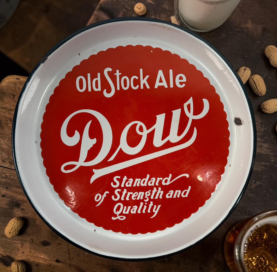 Vintage Dow Old Stock Ale beer advertising tray in enamel-coated metal. Classic Canadian brewery memorabilia with strong red graphics and tavern décor appeal.