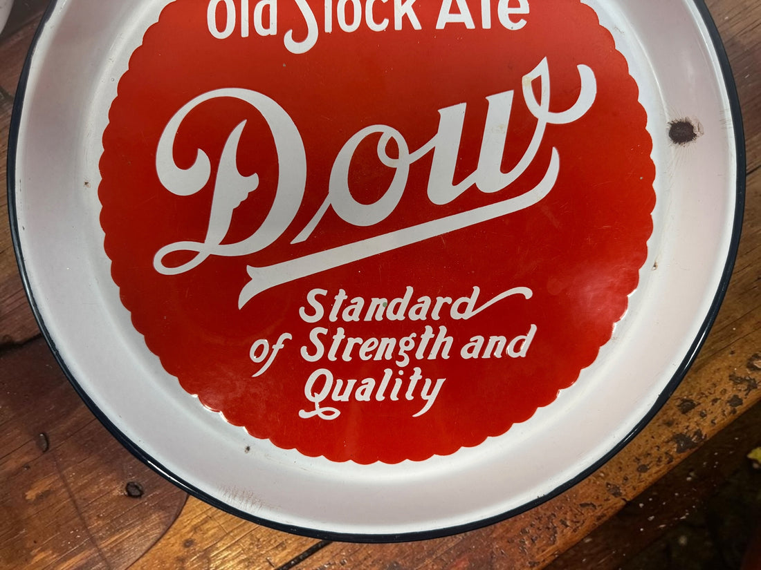Vintage Dow Old Stock Ale beer advertising tray in enamel-coated metal. Classic Canadian brewery memorabilia with strong red graphics and tavern décor appeal.
