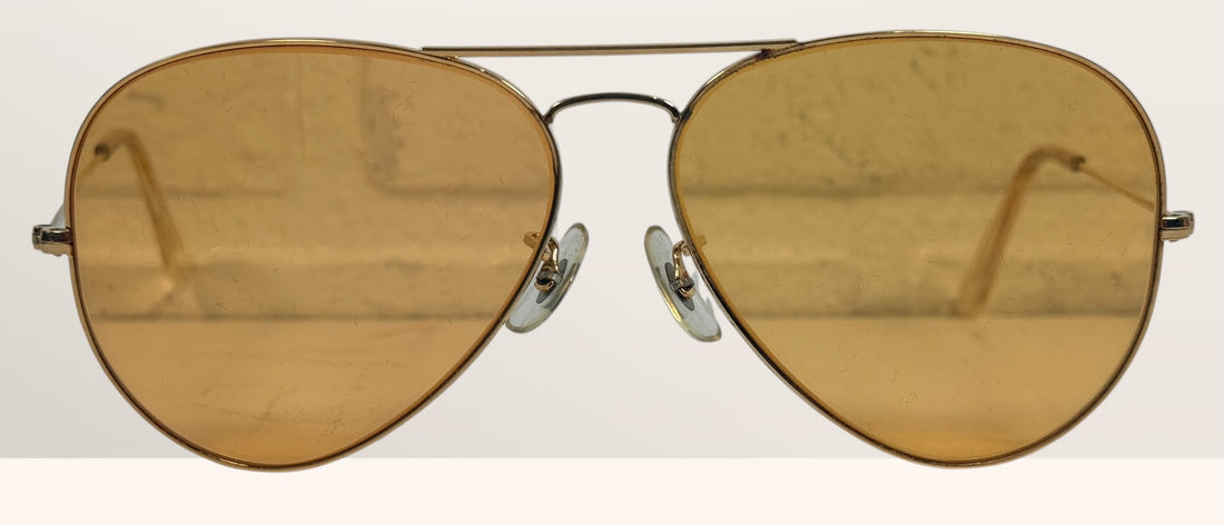 Vintage Bushnell B&amp;L aviator sunglasses with amber lenses and original case, made in USA retro shooting and driving glasses from the 1970s era.