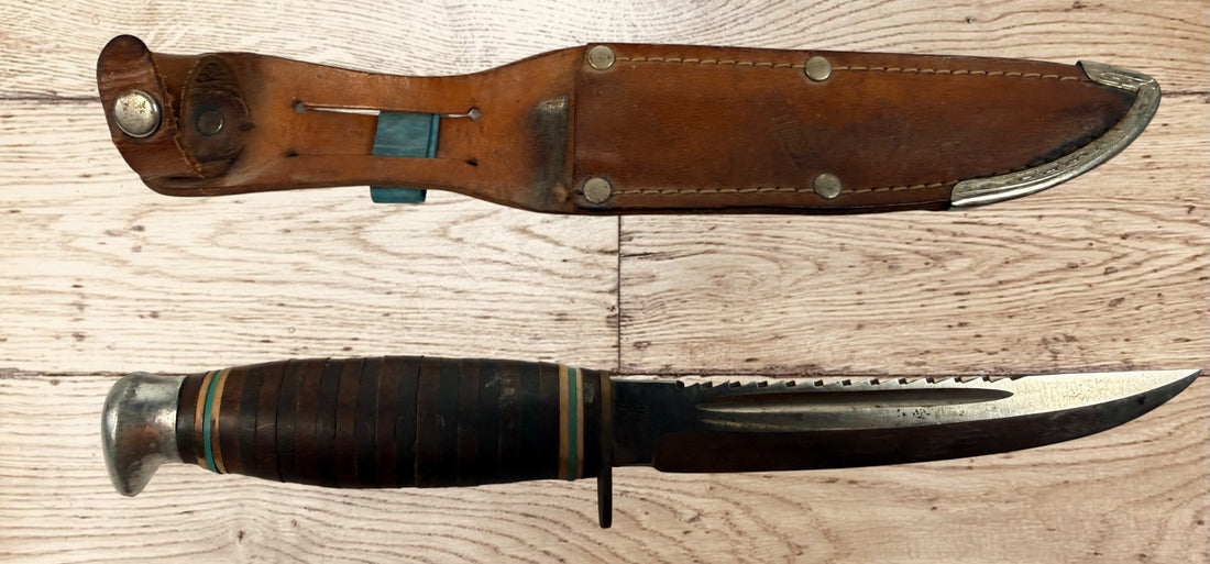 Vintage TRULINE Solingen Germany hunting knife with original leather sheath. Classic stacked leather fixed blade collectible from the mid-century era.