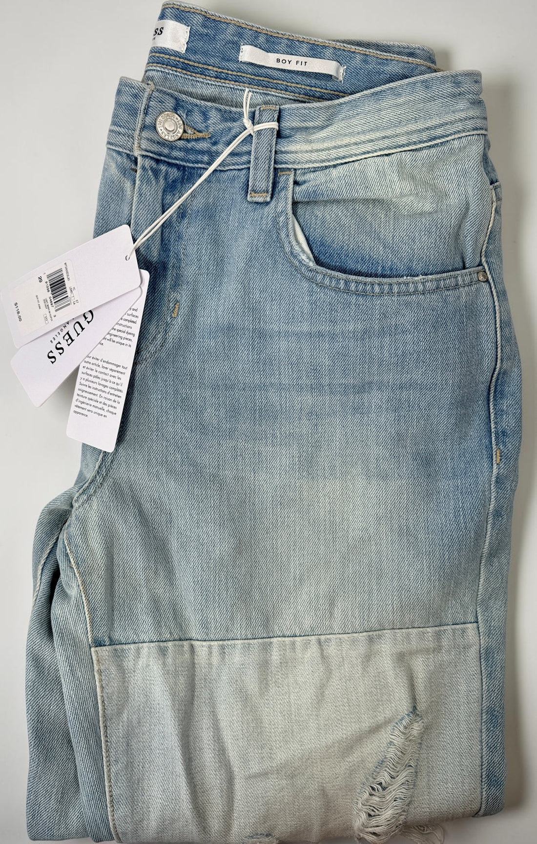 Jeans ajusté Guess pour garçon, denim délavé clair, taille 29.
