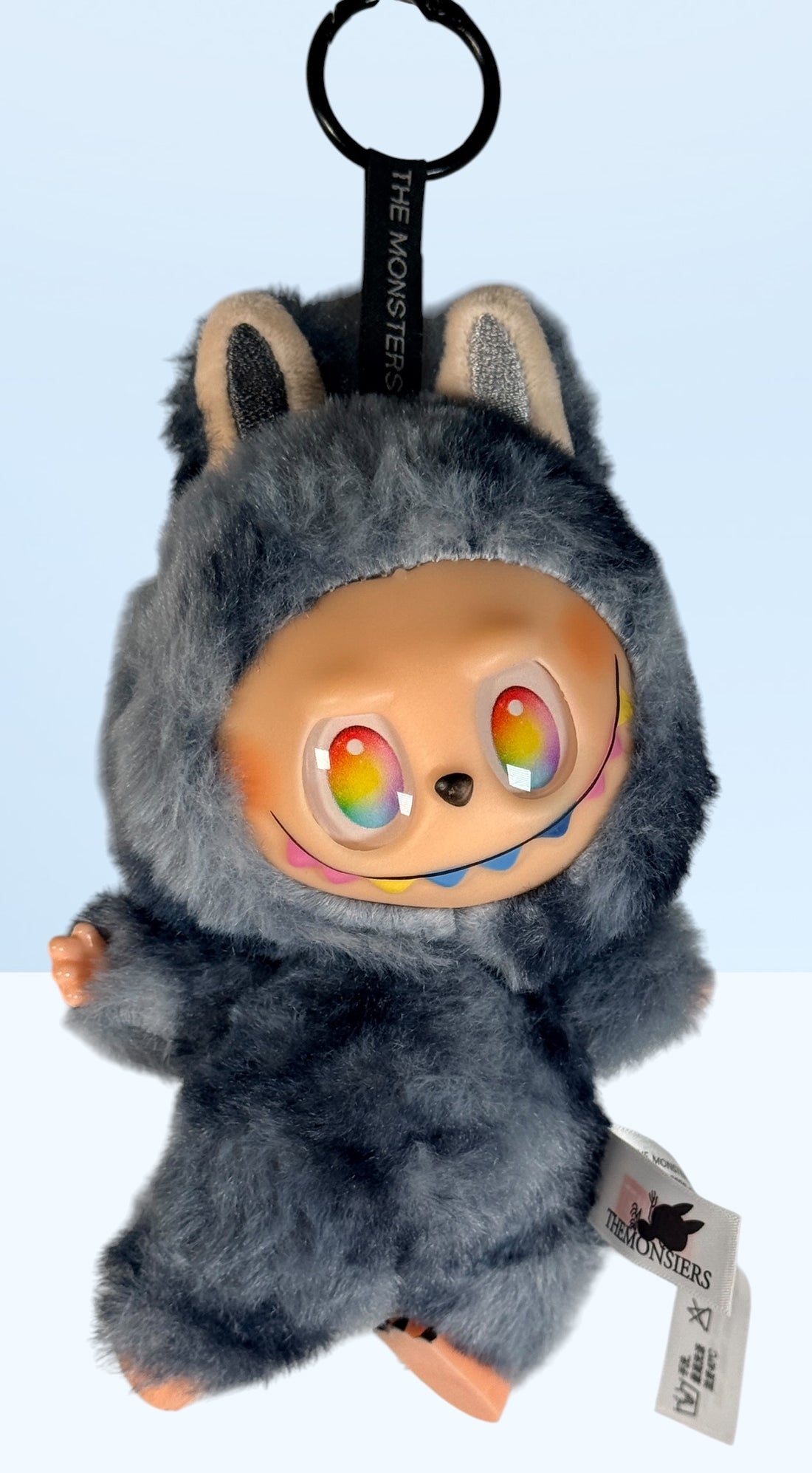 POP MART THE MONSTERS Labubu plush keychain with rainbow eyes and original tags. Collectible designer toy bag charm in excellent condition.
