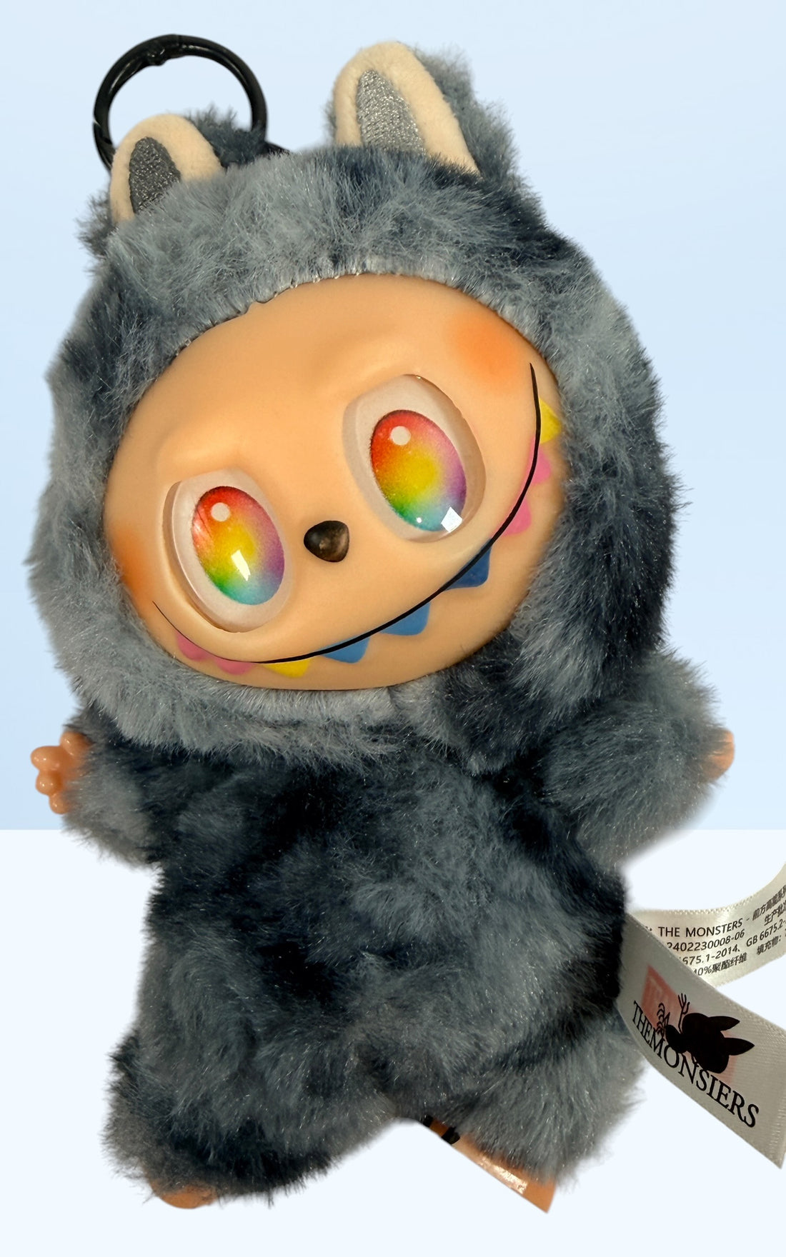 POP MART THE MONSTERS Labubu plush keychain with rainbow eyes and original tags. Collectible designer toy bag charm in excellent condition.