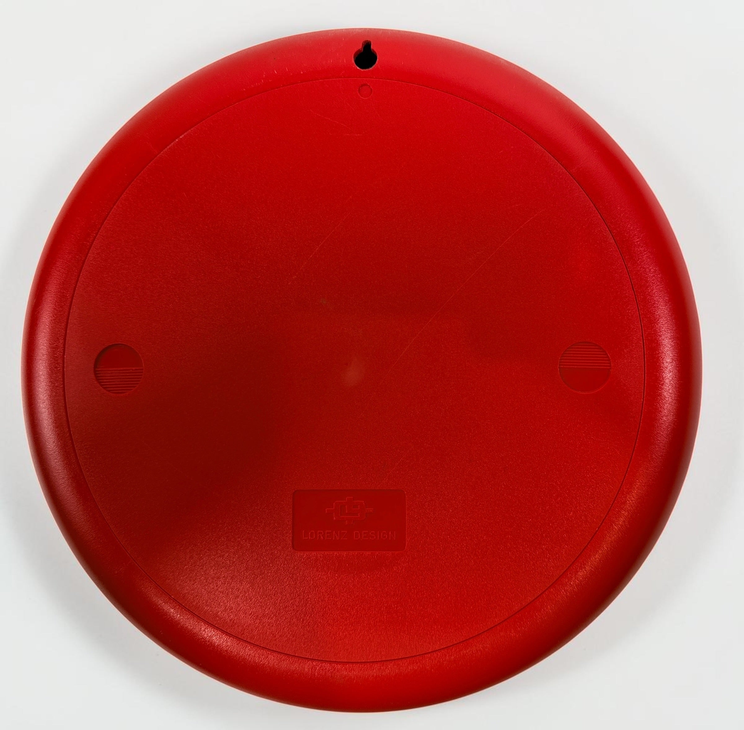 Vintage Italian Lorenz Design postmodern wall clock in bold red Memphis style with geometric dial and 1980s space-age aesthetic.