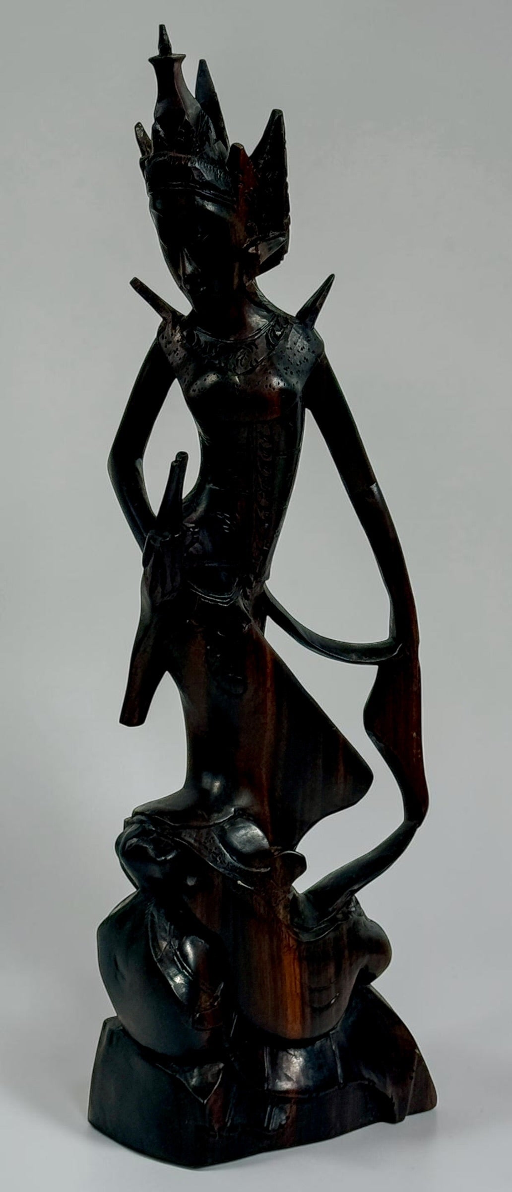 Vintage Balinese carved wood goddess statue from Indonesia. Handcrafted hardwood figure with detailed headdress, 13.5 inches tall.