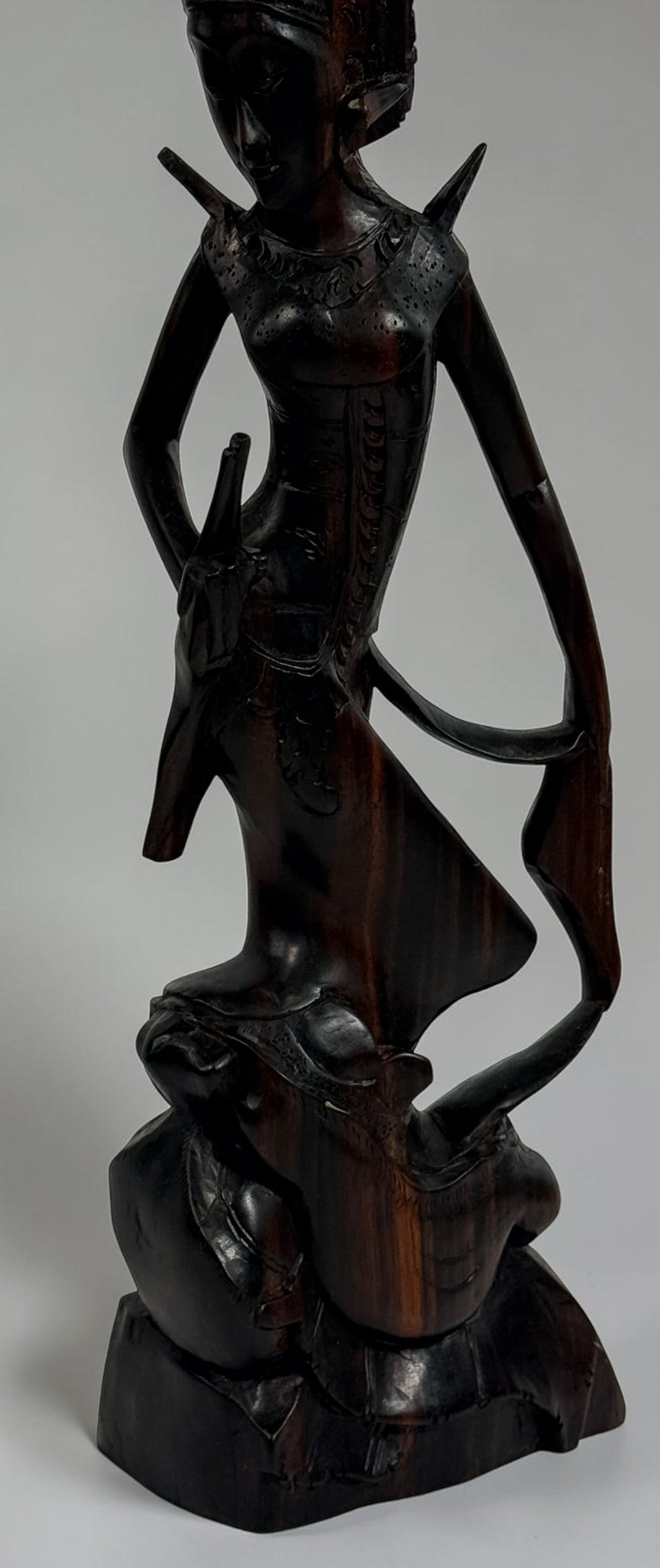 Vintage Balinese carved wood goddess statue from Indonesia. Handcrafted hardwood figure with detailed headdress, 13.5 inches tall.