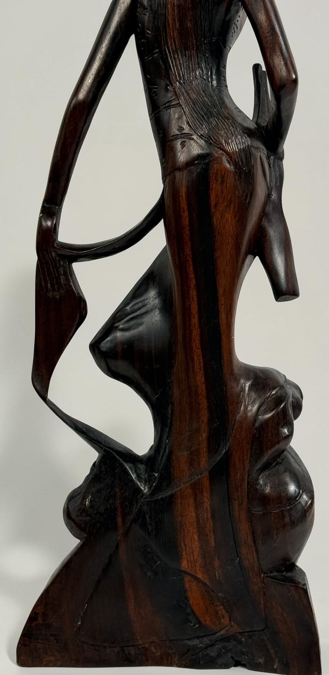 Vintage Balinese carved wood goddess statue from Indonesia. Handcrafted hardwood figure with detailed headdress, 13.5 inches tall.