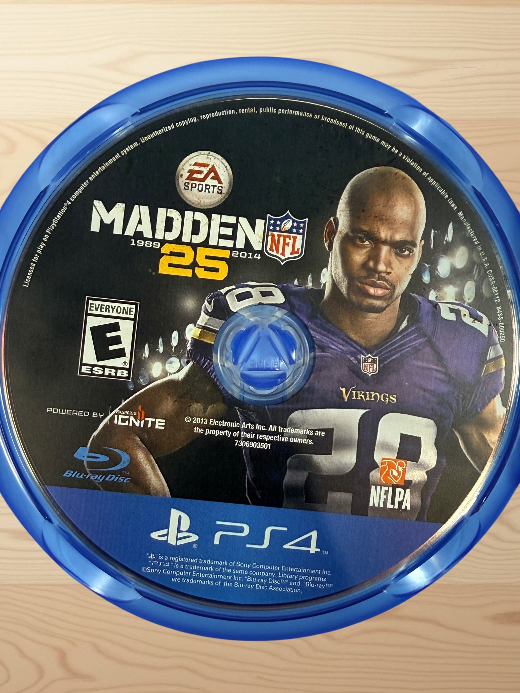 Complete-in-box PS4 Madden NFL 25 game with original case and disc. Classic EA Sports football title featuring Adrian Peterson.