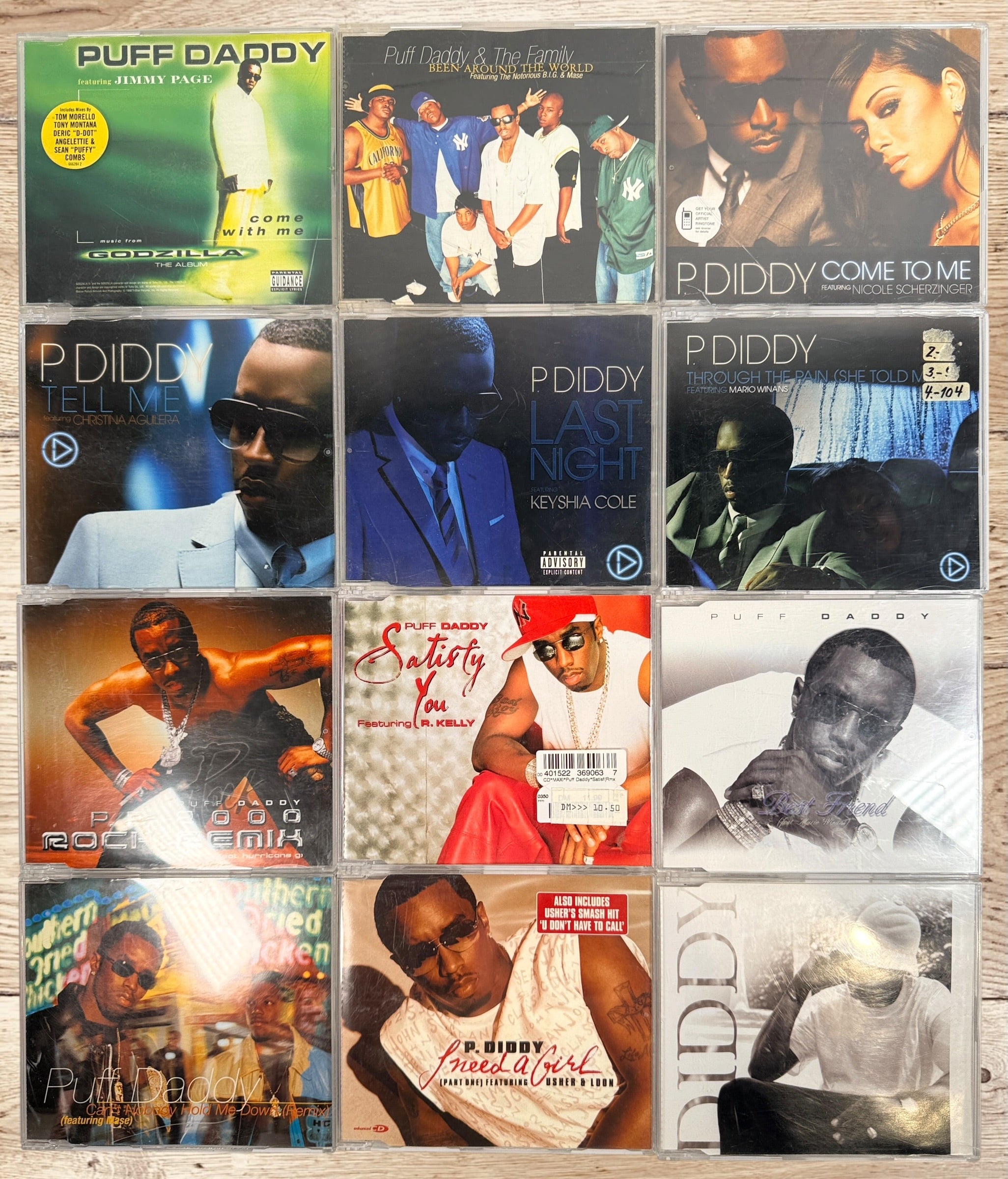 Collectible Puff Daddy and P. Diddy CD single lot featuring Bad Boy Records hip-hop classics from the late 1990s and early 2000s.