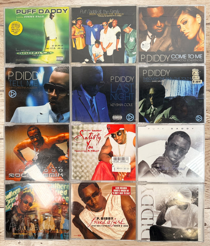 Collectible Puff Daddy and P. Diddy CD single lot featuring Bad Boy Records hip-hop classics from the late 1990s and early 2000s.