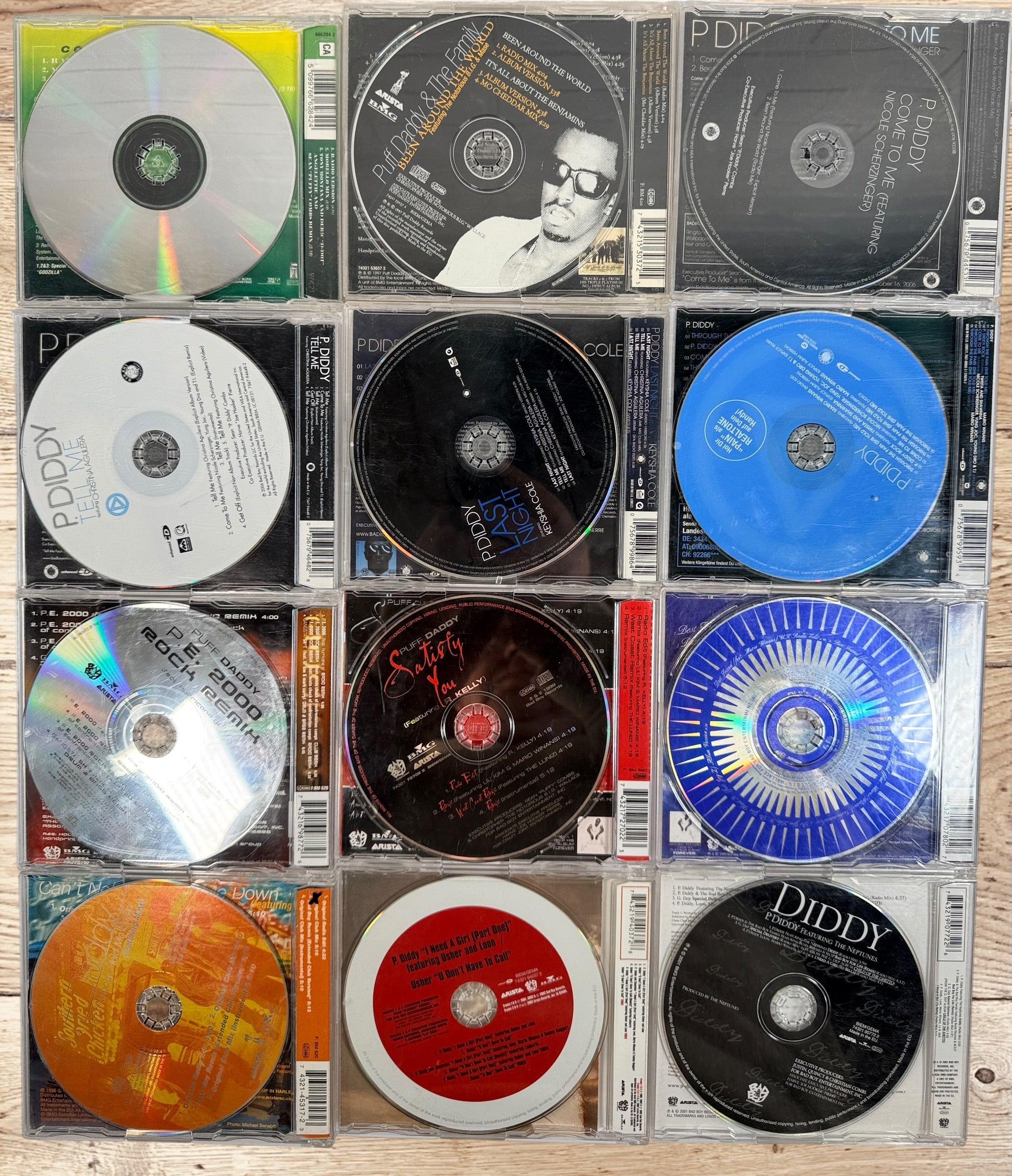 Collectible Puff Daddy and P. Diddy CD single lot featuring Bad Boy Records hip-hop classics from the late 1990s and early 2000s.