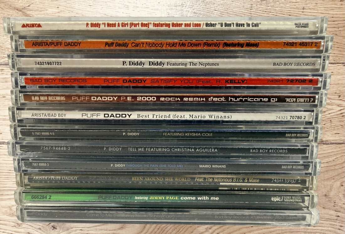 Collectible Puff Daddy and P. Diddy CD single lot featuring Bad Boy Records hip-hop classics from the late 1990s and early 2000s.