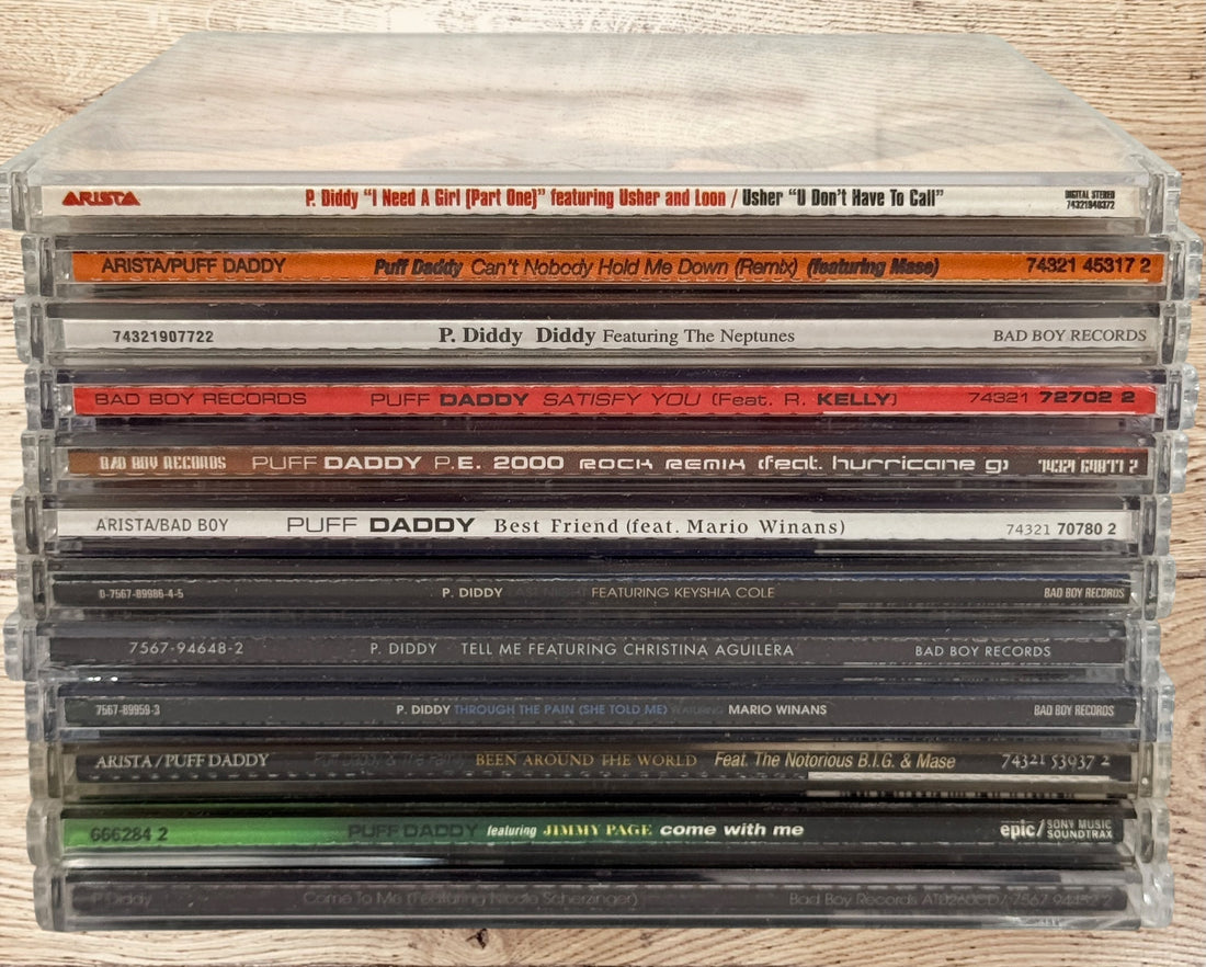 Collectible Puff Daddy and P. Diddy CD single lot featuring Bad Boy Records hip-hop classics from the late 1990s and early 2000s.