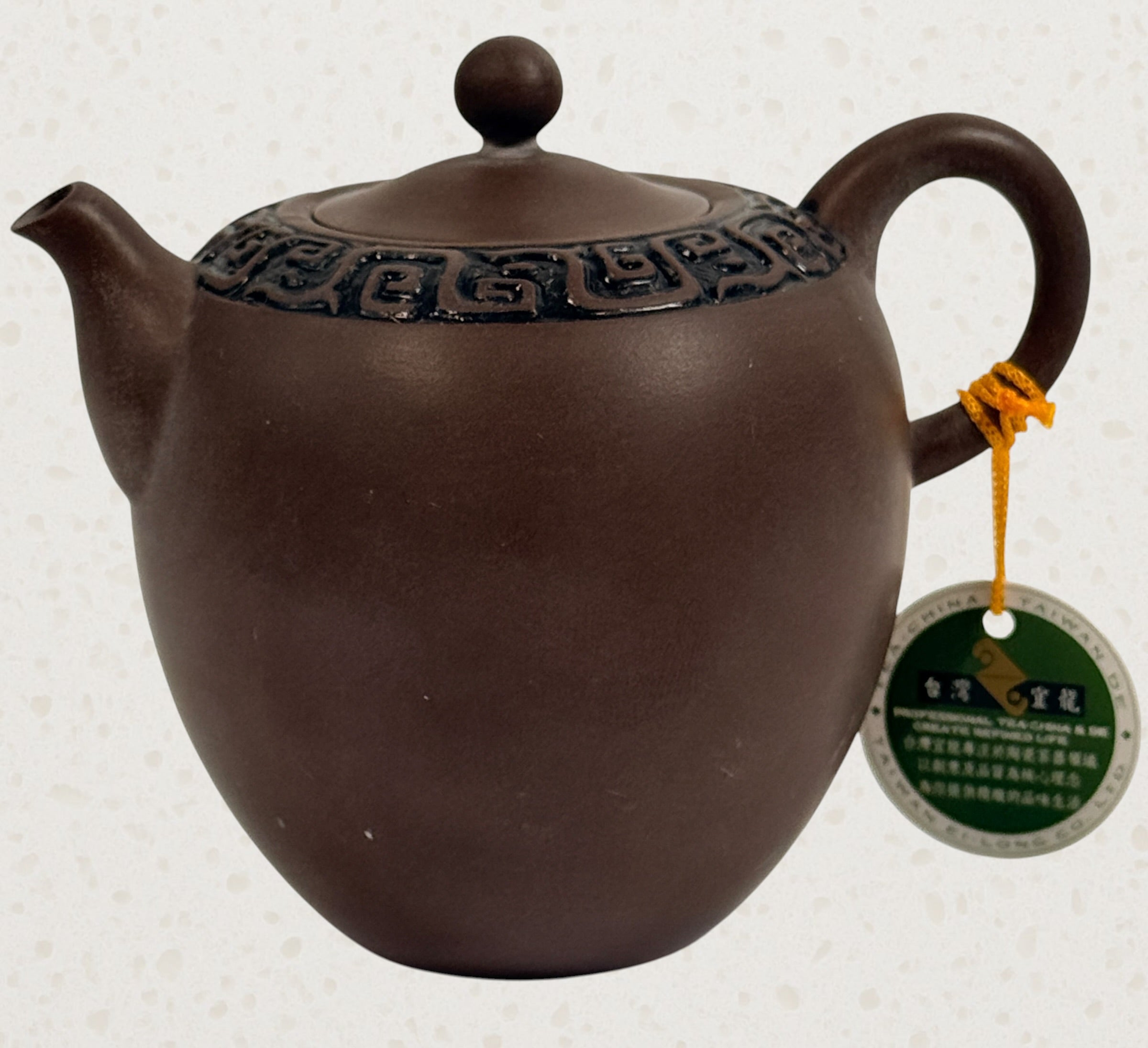 Modern Taiwanese clay tea set with teapot and two cups in original satin-lined gift box featuring Yixing-inspired styling and geometric carved detailing.