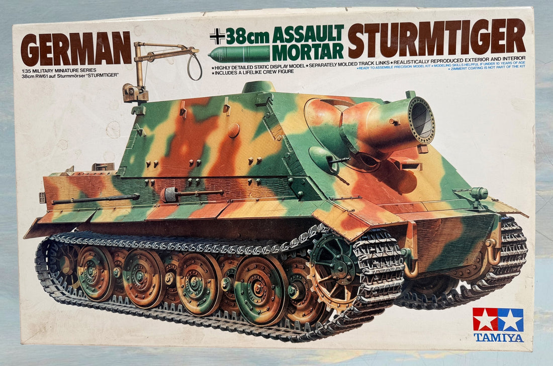 Vintage Tamiya 1/35 Sturmtiger model kit with original box, instructions, and sealed parts. Classic WWII German armor collectible made in Japan.