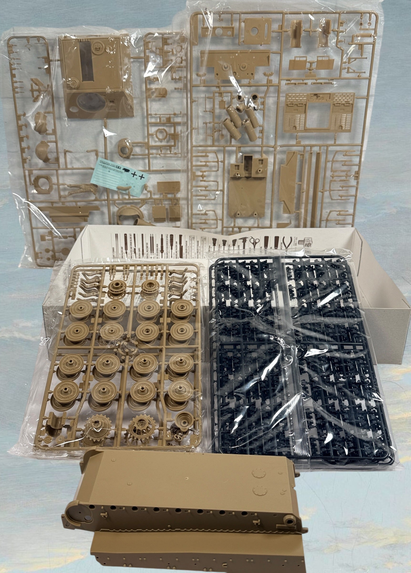 Vintage Tamiya 1/35 Sturmtiger model kit with original box, instructions, and sealed parts. Classic WWII German armor collectible made in Japan.