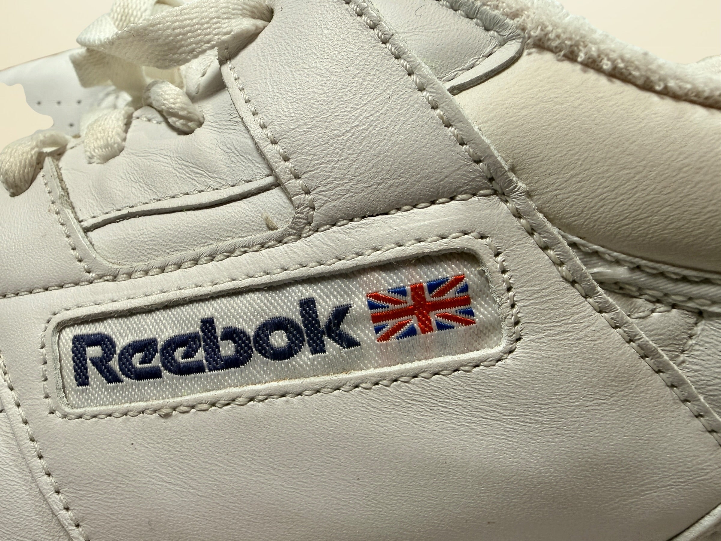 Vintage Reebok Classic leather sneakers size 14 with gum soles and retro white leather styling. Rare larger size Y2K casual athletic shoes.