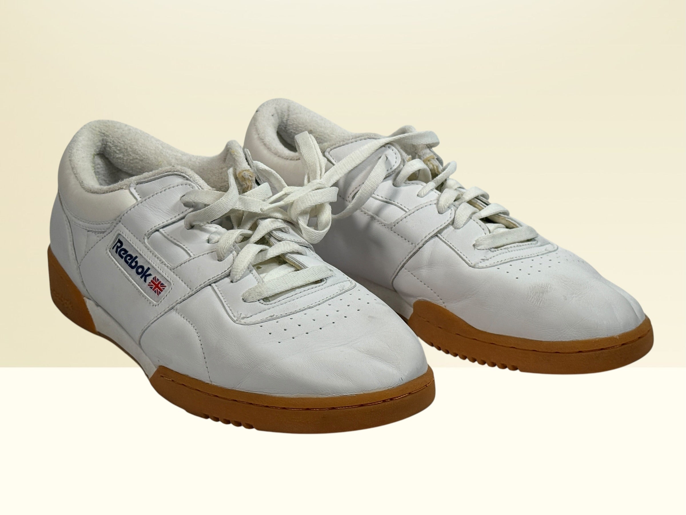 Vintage Reebok Classic leather sneakers size 14 with gum soles and retro white leather styling. Rare larger size Y2K casual athletic shoes.