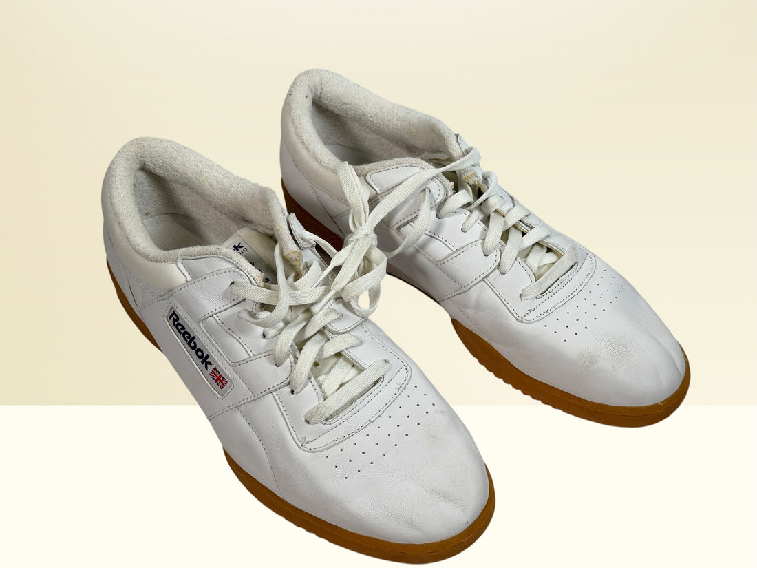 Vintage Reebok Classic leather sneakers size 14 with gum soles and retro white leather styling. Rare larger size Y2K casual athletic shoes.