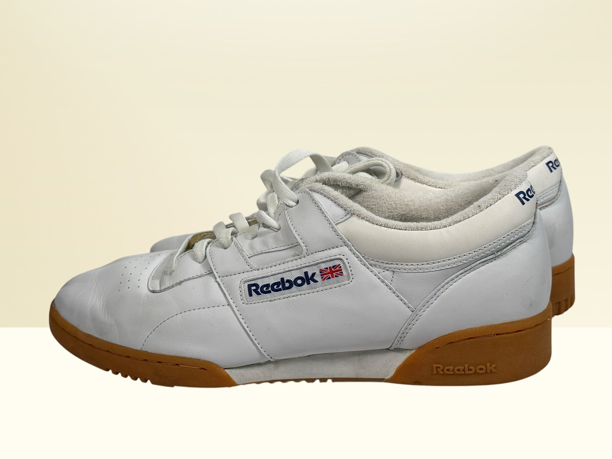 Vintage Reebok Classic leather sneakers size 14 with gum soles and retro white leather styling. Rare larger size Y2K casual athletic shoes.