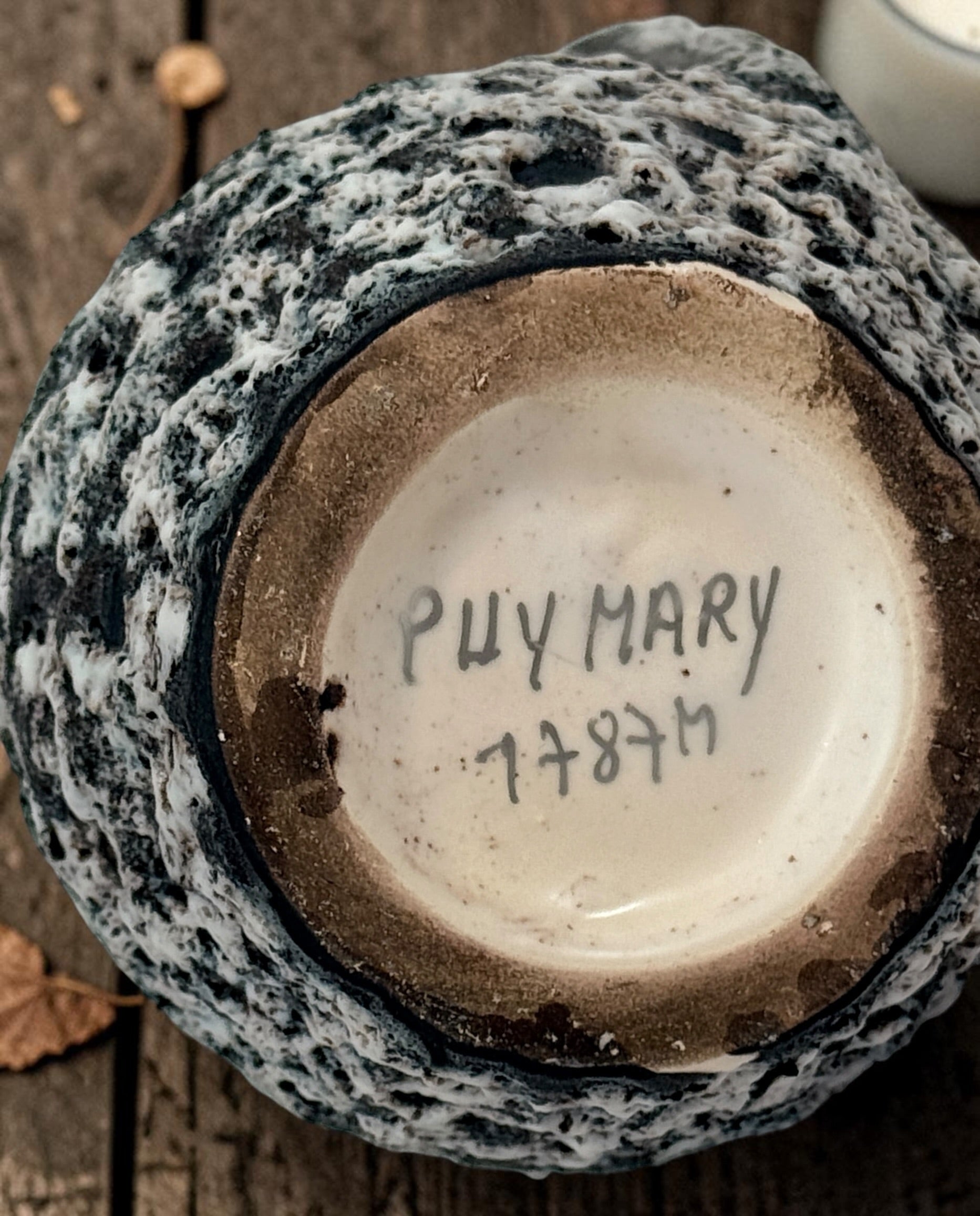 Vintage French brutalist lava glaze vase by Puy Mary featuring volcanic black and white texture and sculptural 1970s ceramic design.