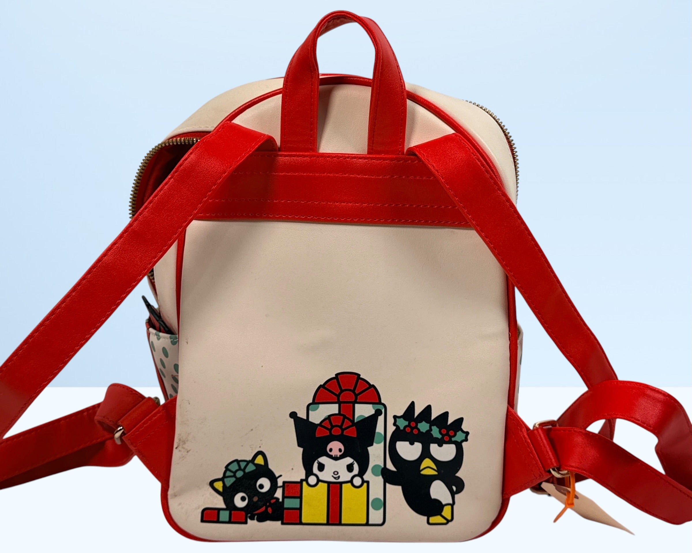 Her Universe Hello Kitty Christmas mini backpack featuring Sanrio characters in a festive holiday design with adjustable straps and kawaii collectible style.