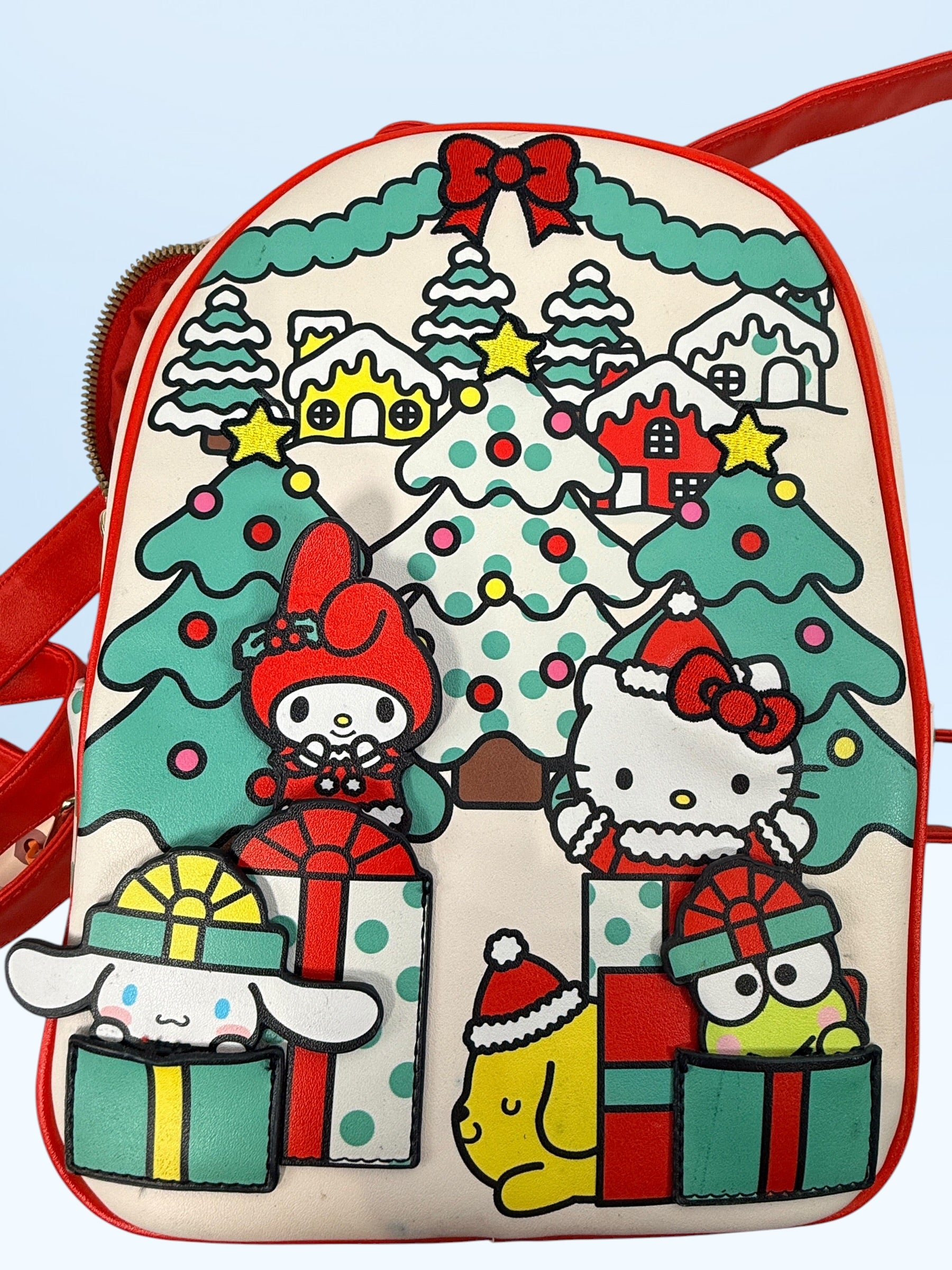 Her Universe Hello Kitty Christmas mini backpack featuring Sanrio characters in a festive holiday design with adjustable straps and kawaii collectible style.