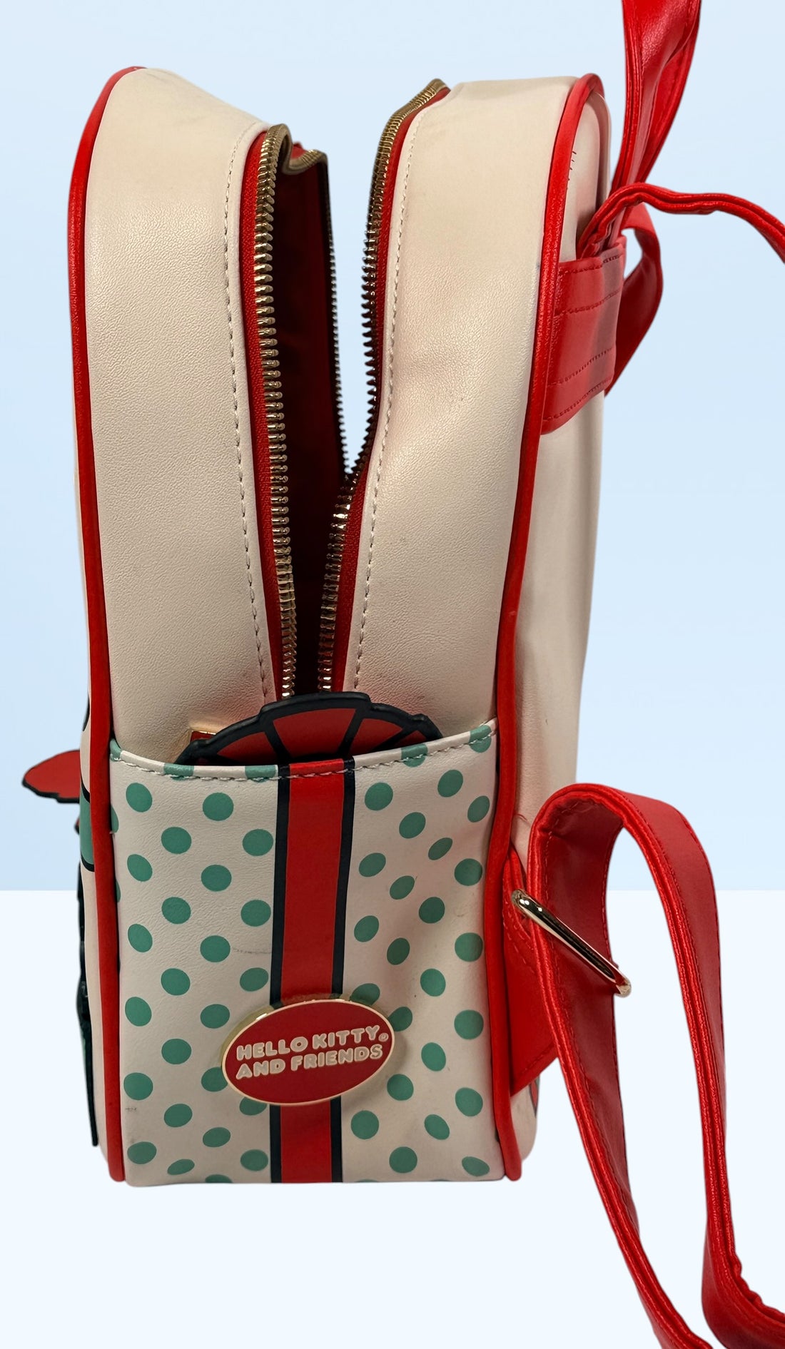 Her Universe Hello Kitty Christmas mini backpack featuring Sanrio characters in a festive holiday design with adjustable straps and kawaii collectible style.