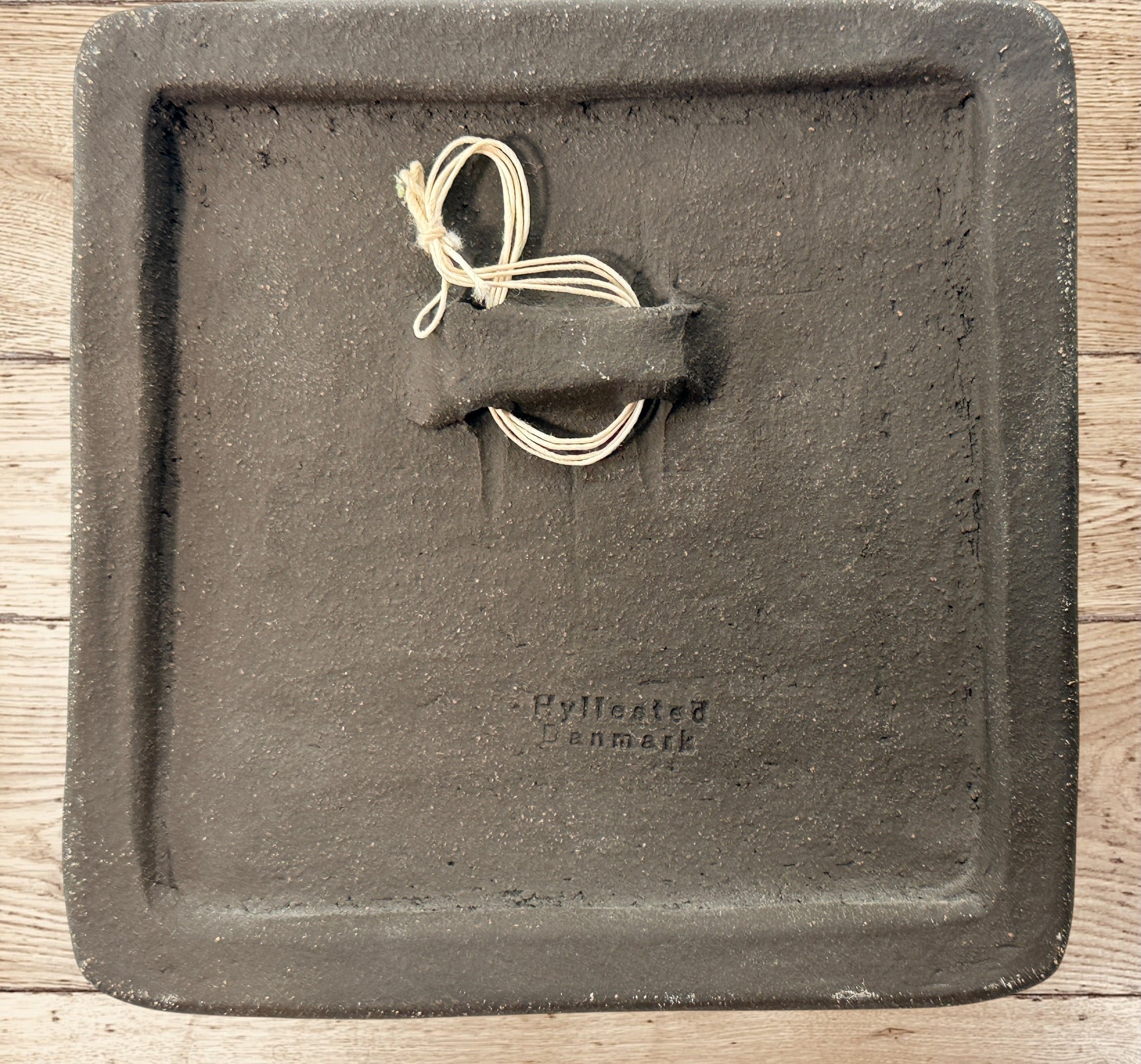 Vintage Hyllested Keramik Denmark wall plaque in Adam Zwior style featuring Inuit relief art and Scandinavian chamotte stoneware design.